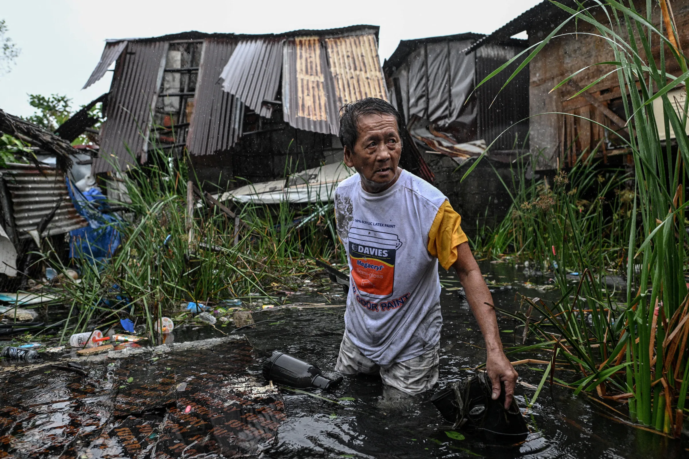 A man wades through the flood after Typhoon Fung-wong hit Dagupan City, Pangasinan, Philippines, November 10. REUTERS/Noel Celis