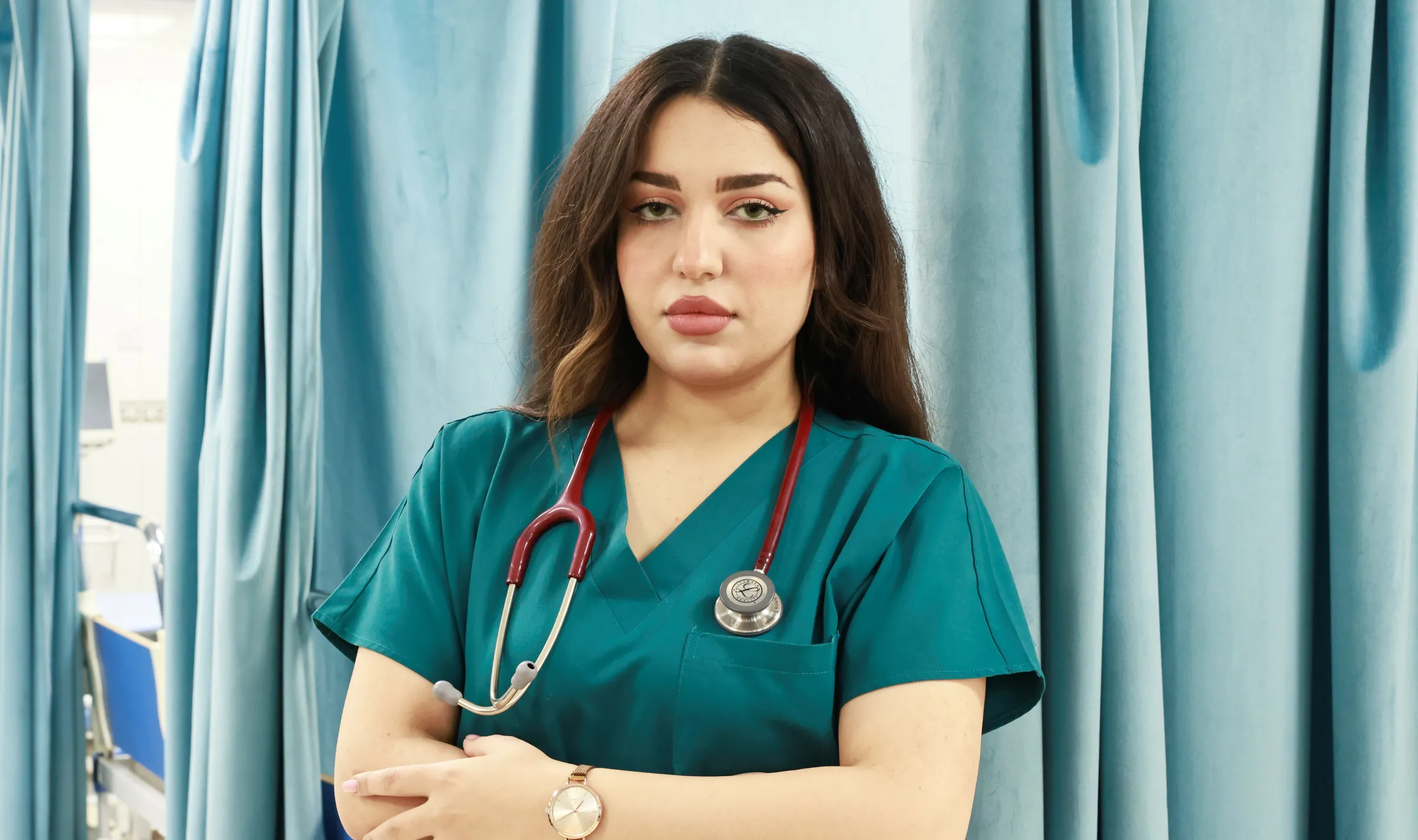 Dr. Amina Sabbar, 26, standing in the hospital she works in. Baghdad, Iraq, March 6, 2023. Thomson Reuters Foundation/Abdullah Dhiaa al-Deen