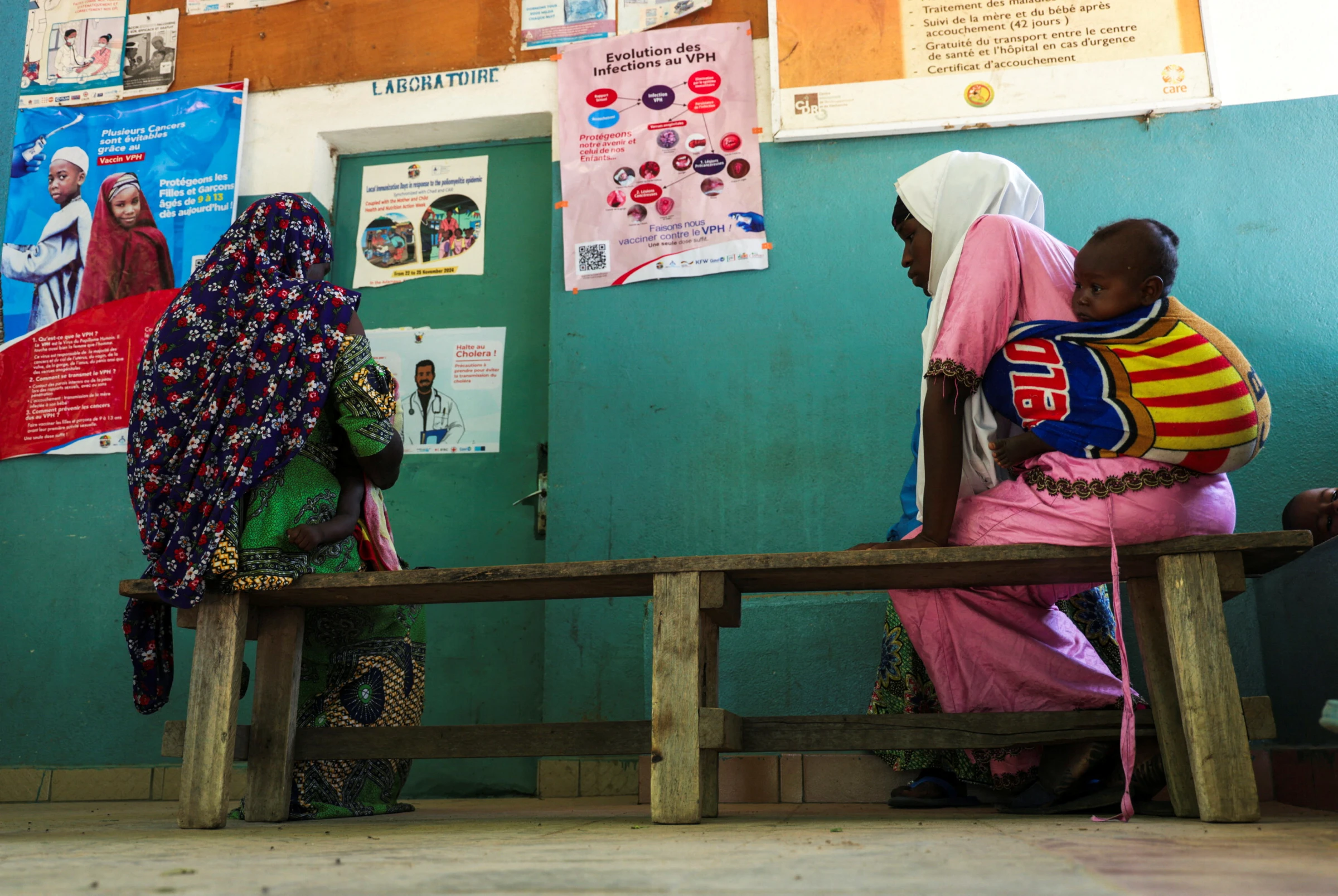 Women sit as they wait for medical consultation at a Health Center, in Bogo Cameroon September 2, 2025. REUTERS/Desire Danga Essigue