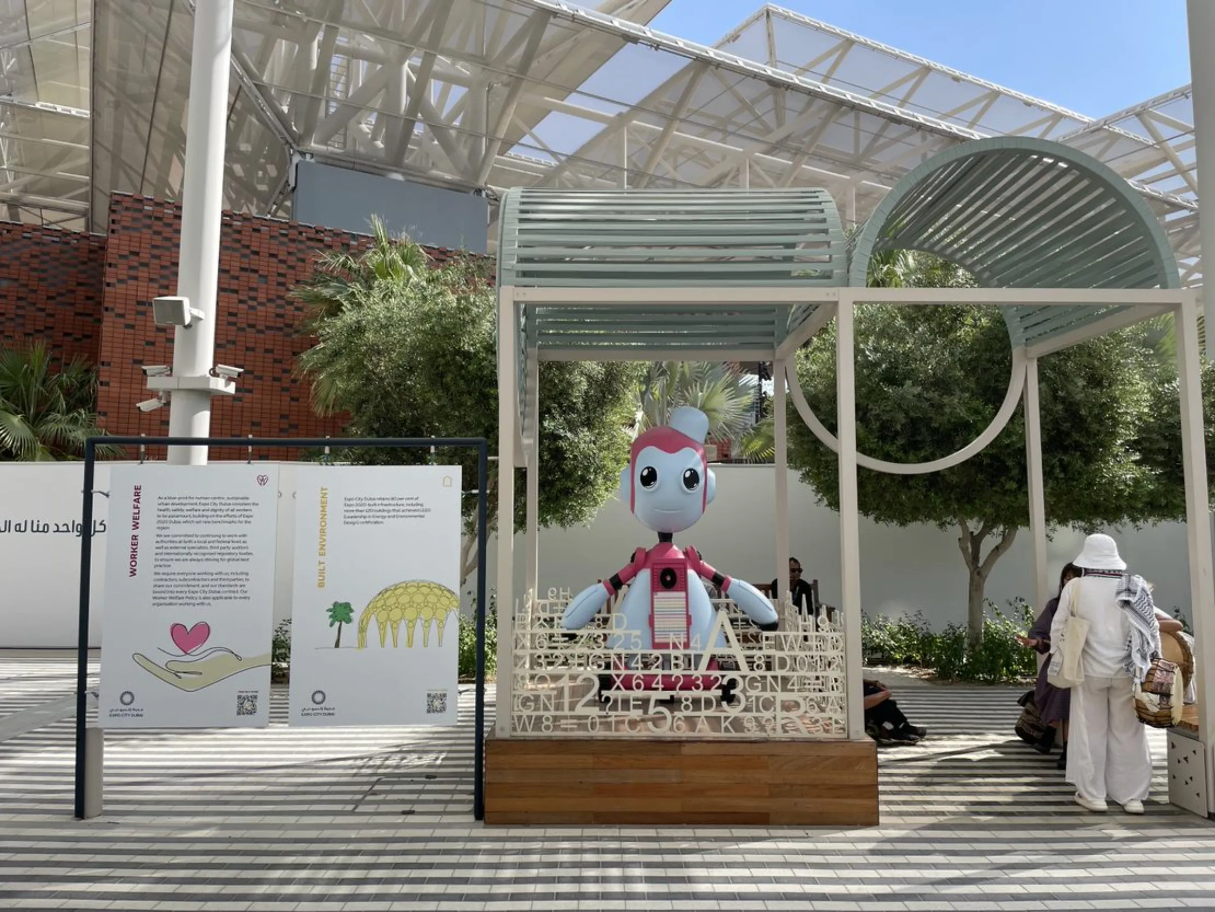 A mascot outside the rooms of the United Nations Climate Change Conference (COP28) in Dubai, United Arab Emirates, December 3, 2023. Thomson Reuters Foundation/Jack Graham