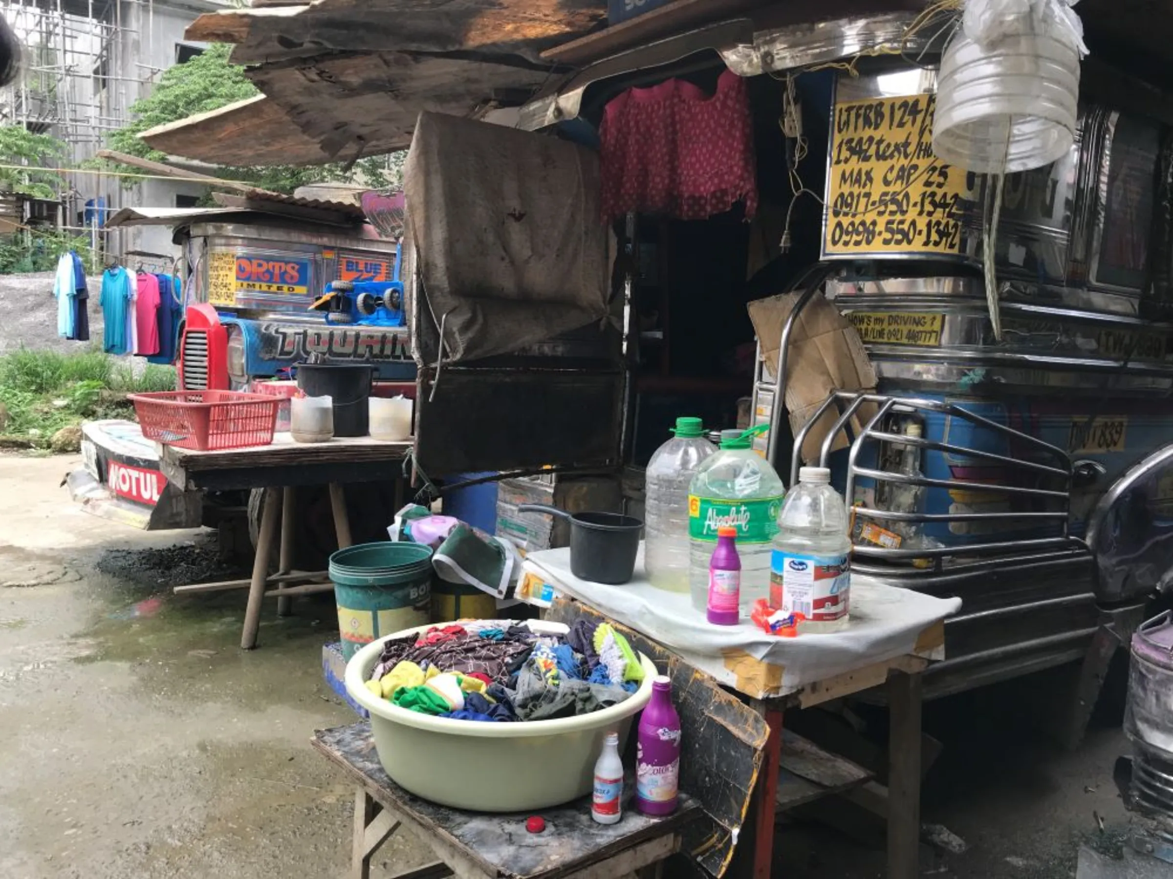 In this traditional jeepney garage in Marikina City, drivers who were forced off the road due to Covid-19 restrictions also use their units as temporary home. September 16, 2022