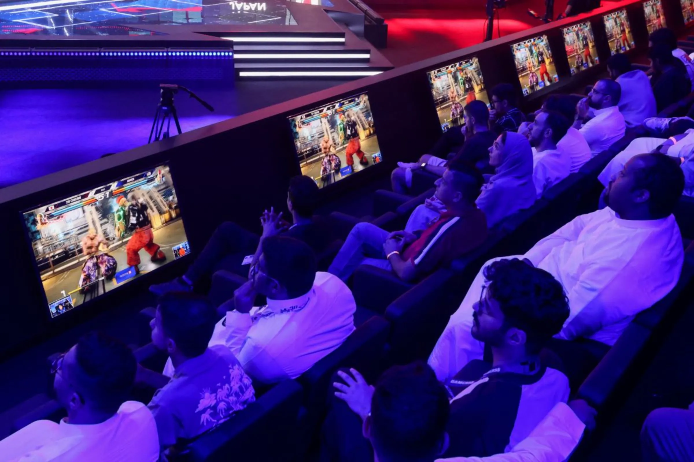 Spectators watch video games as gamers from different countries play during an esports and gaming festival Gamers8 at Boulevard Riyadh, Saudi Arabia, July 9, 2023. REUTERS/Ahmed Yosri