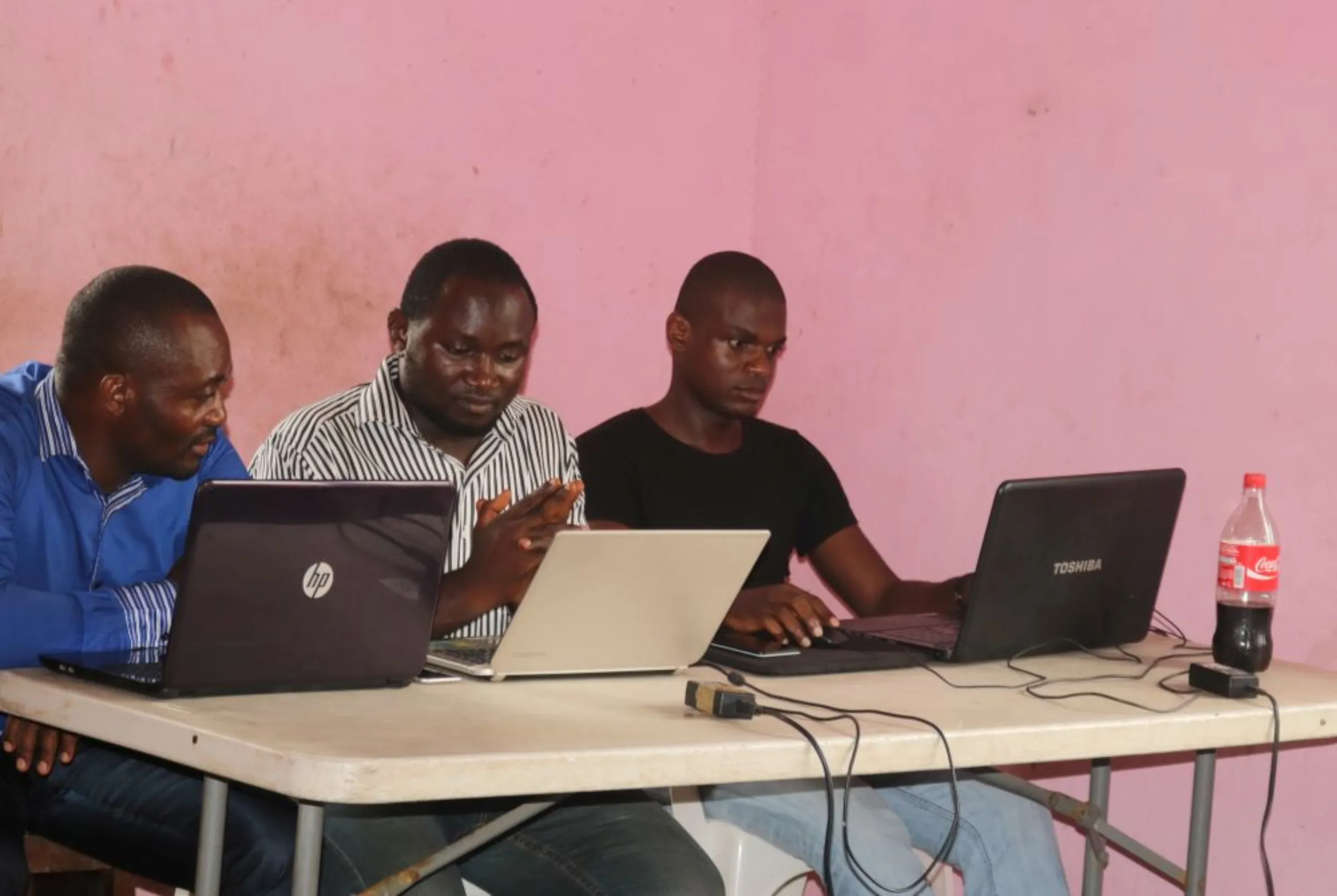 Young startup promoters work on their computers in New Bonako village, Cameroon March 28, 2017