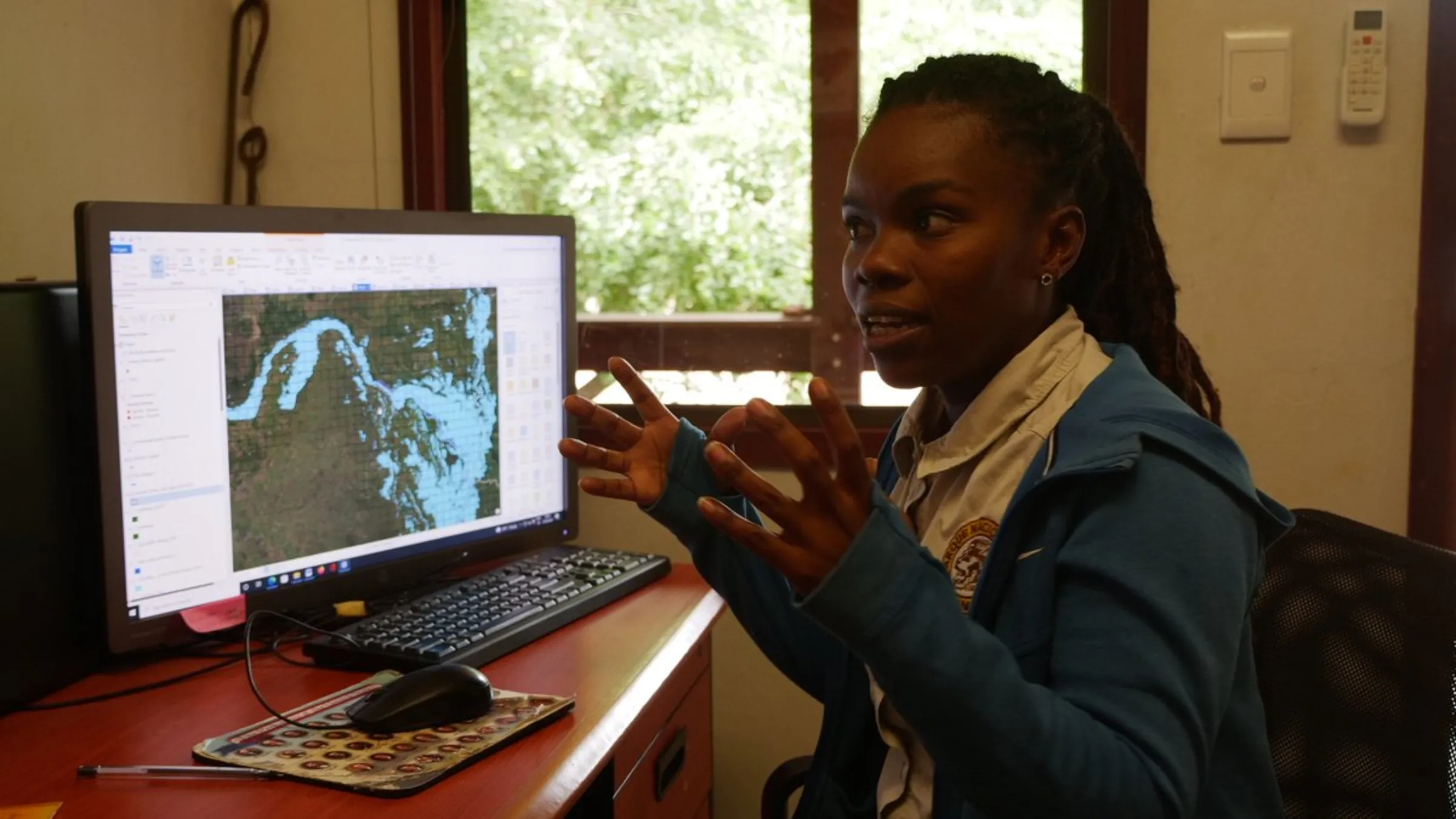 Margardia Victor, a Geographic Information System (GIS) expert working at Gorongosa National Park, shows how the reserve’s technology was used to map flood areas during Cyclone Idai, which slammed that area of Mozambique in 2019, May 23, 2022