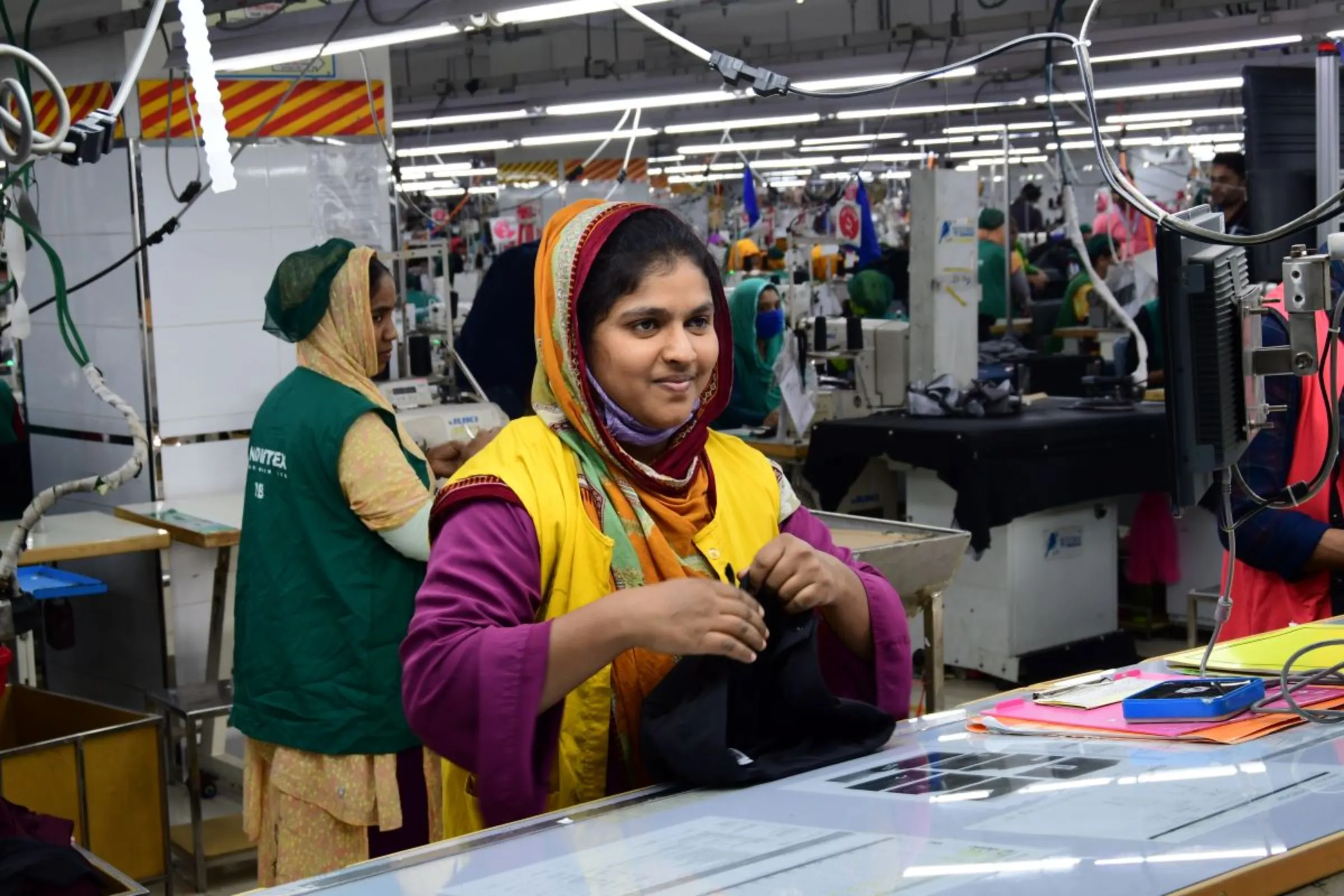 Shefali Akter works at a Snowtex Outerware garment factory in Dhamrai, Bangladesh, January 30, 2023. Thomson Reuters Foundation/Mosabber Hossain