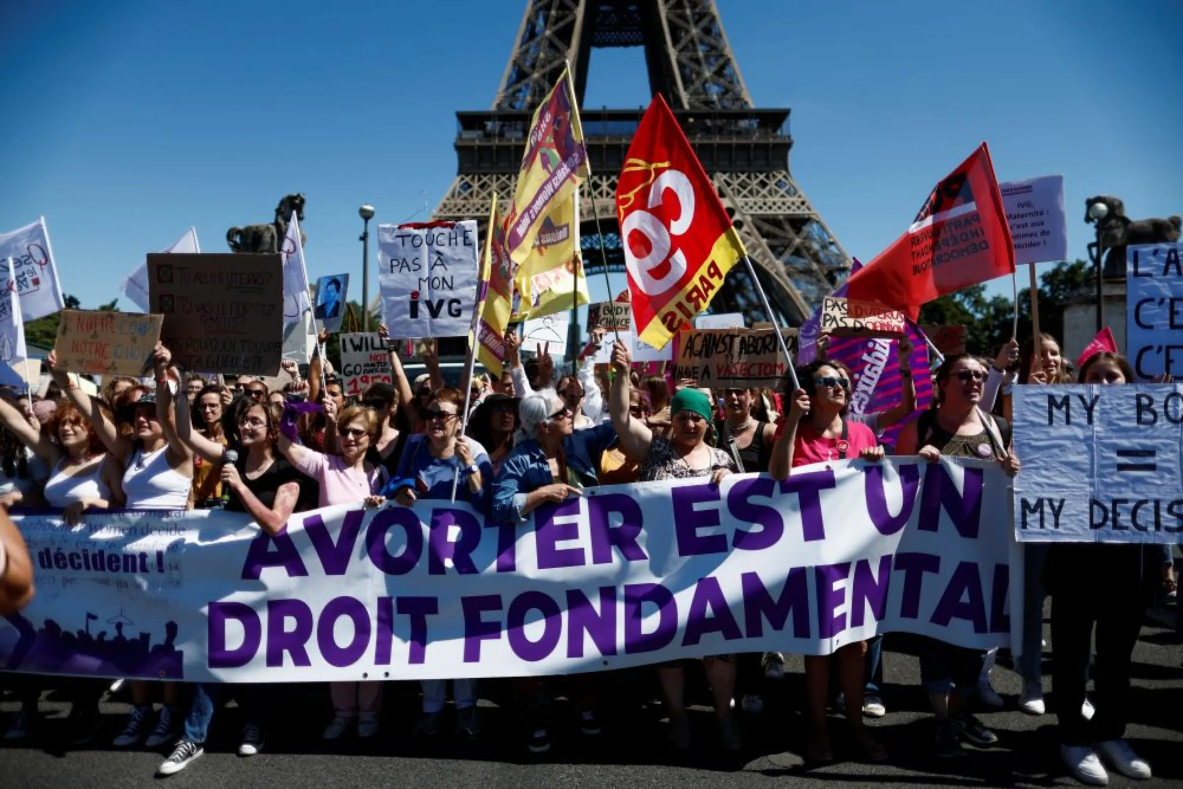 Protesters hold a banner reading 'abortion is a basic right' during a rally in support of abortion rights following the U.S. Supreme Court overturning Roe v. Wade, in Paris, France, July 2, 2022