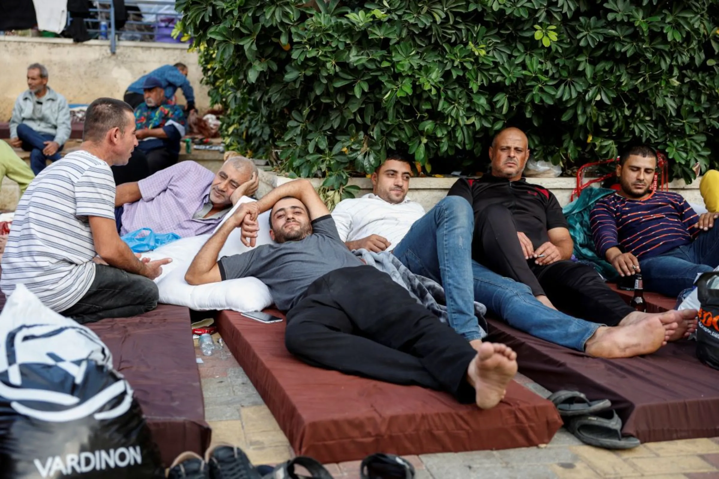 Displaced workers from Gaza rest at a recreational centre where hundreds of workers from Gaza are staying after they were deported from Israel following the October 7 Hamas attacks, in Ramallah, in the Israeli-occupied West Bank November 13, 2023. REUTERS/James Oatway