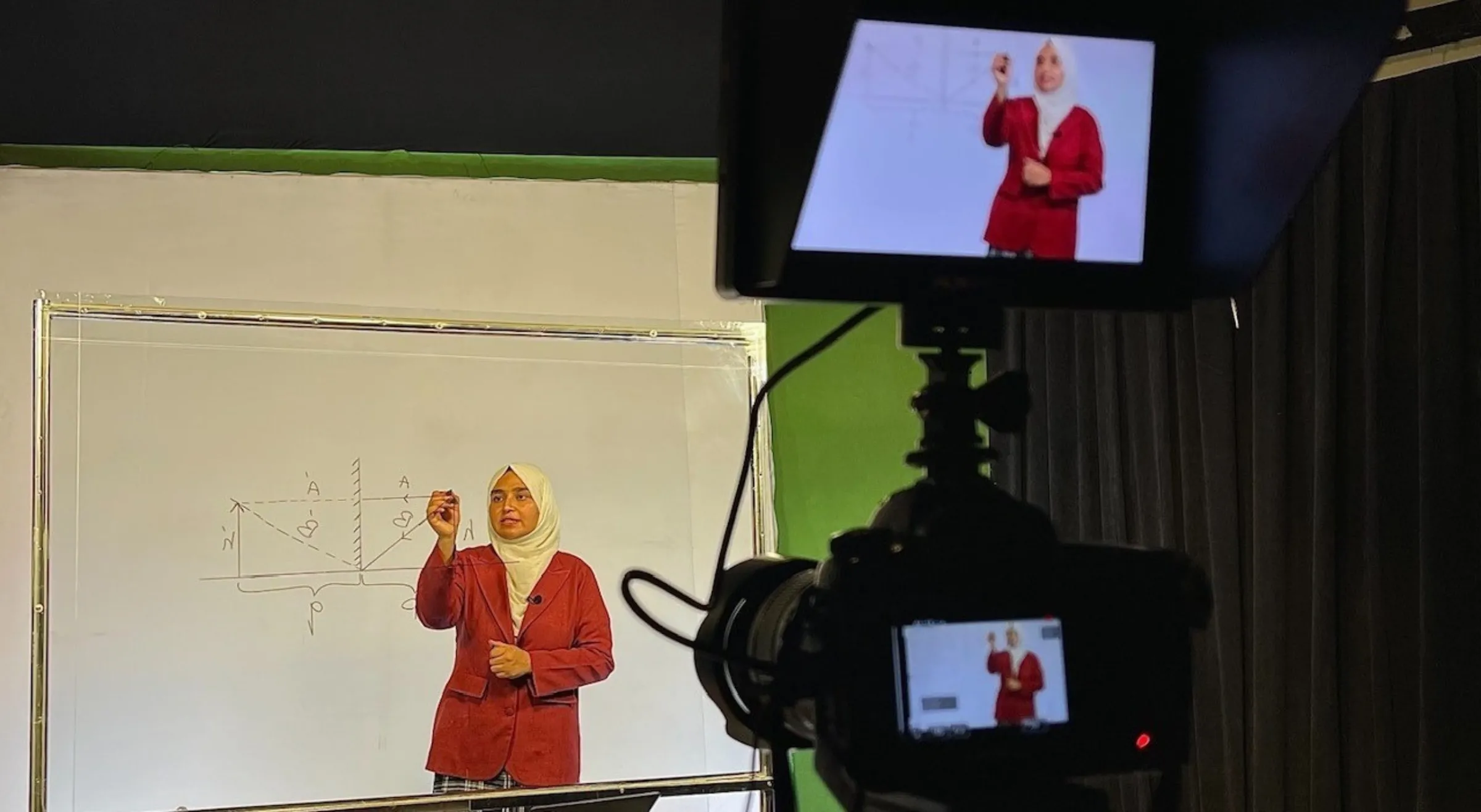 A teacher is filmed delivering a geometry lesson for Begum Academy. Begum Organization for Women/Handout via Thomson Reuters Foundation