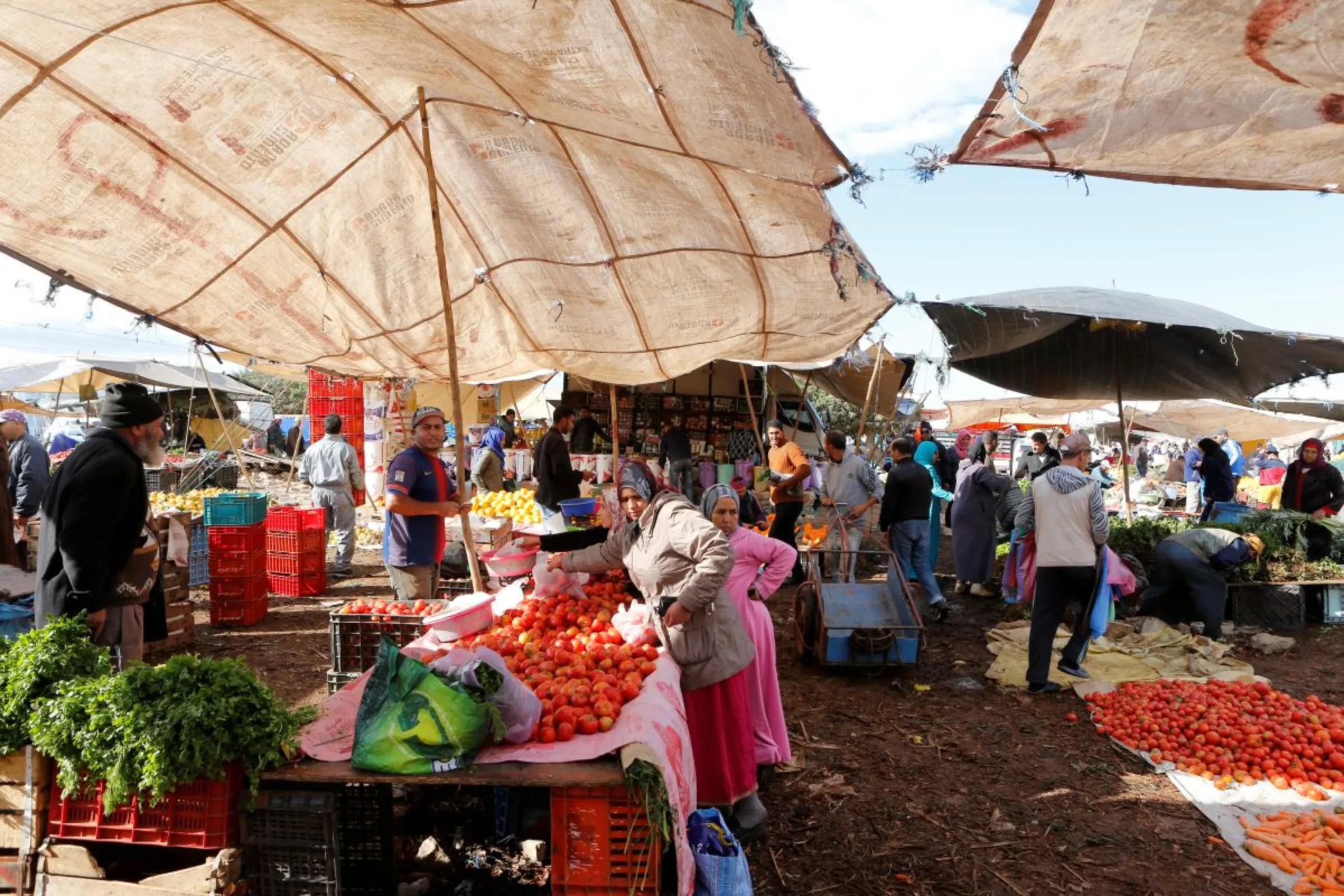 People shop at a vegetable market on the outskirts of Casablanca, Morocco, October 23, 2019
