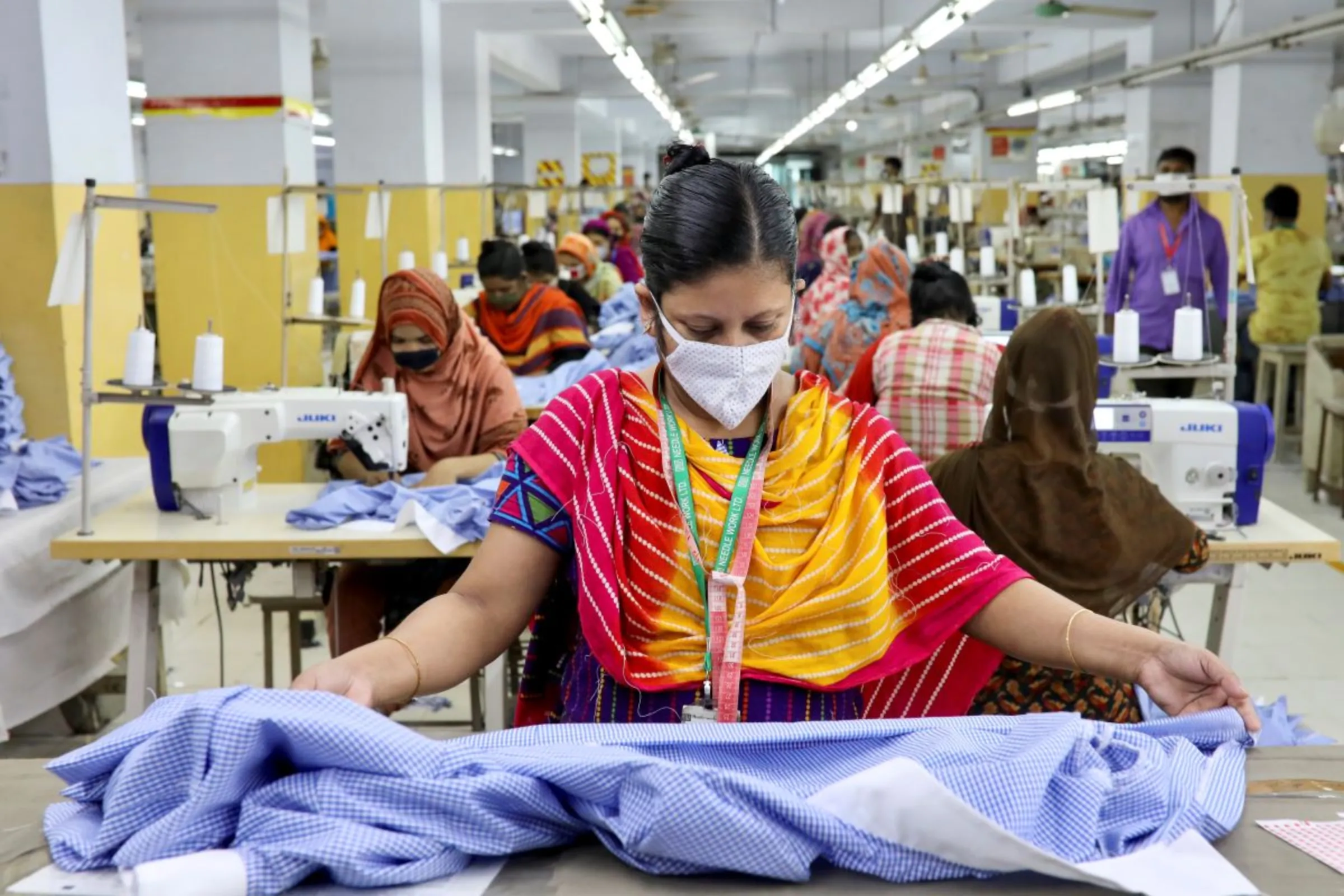 A woman works in a garment factory in Dhaka, Bangladesh, May 3, 2020. REUTERS/Mohammad Ponir Hossain