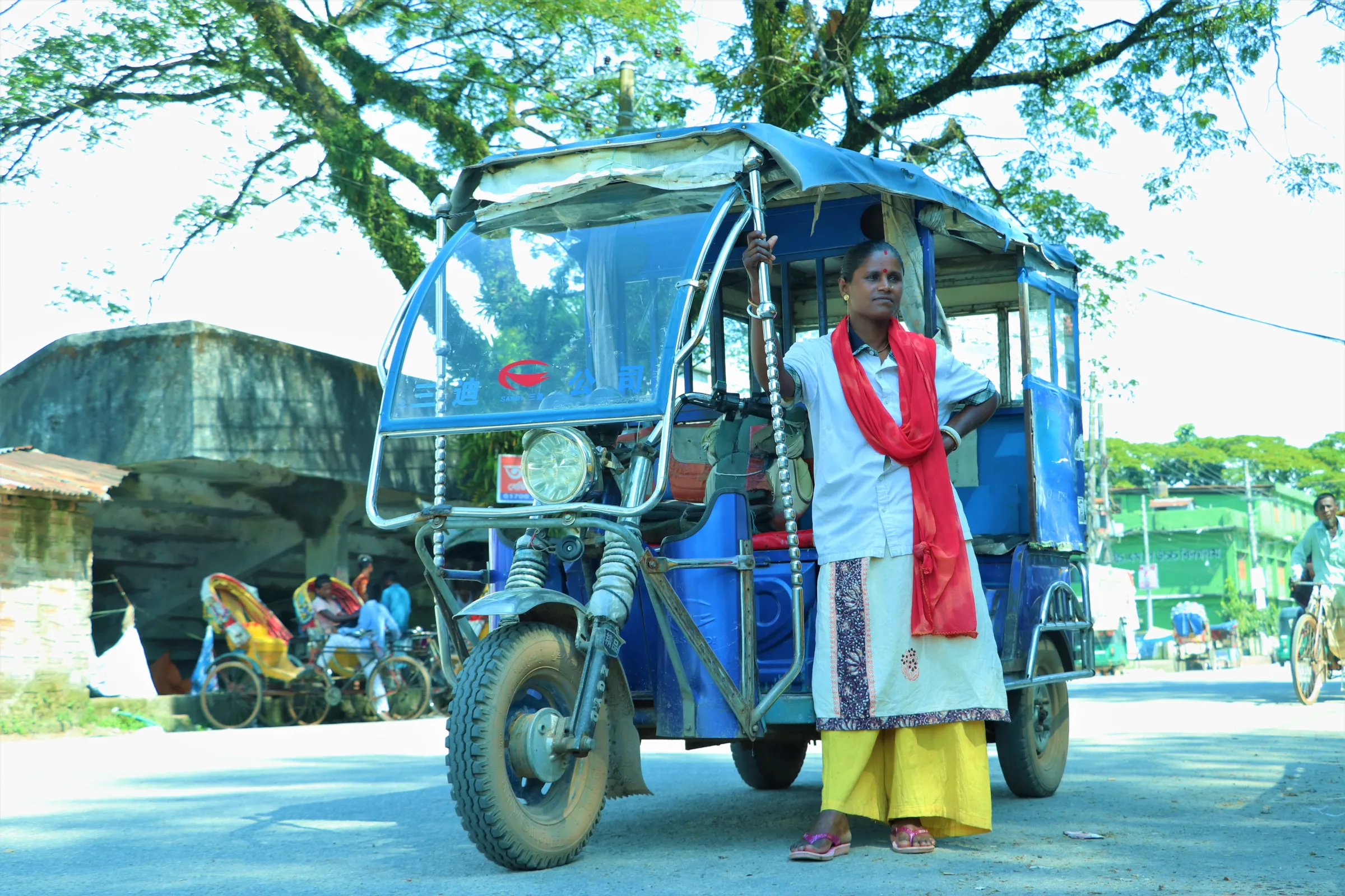 Jatri Rani Barman (32), the only woman driver of an electric vehicle in the northeastern town of Sunamganj is waiting for passengers, Sunamganj, Bangladesh, October 10, 2022