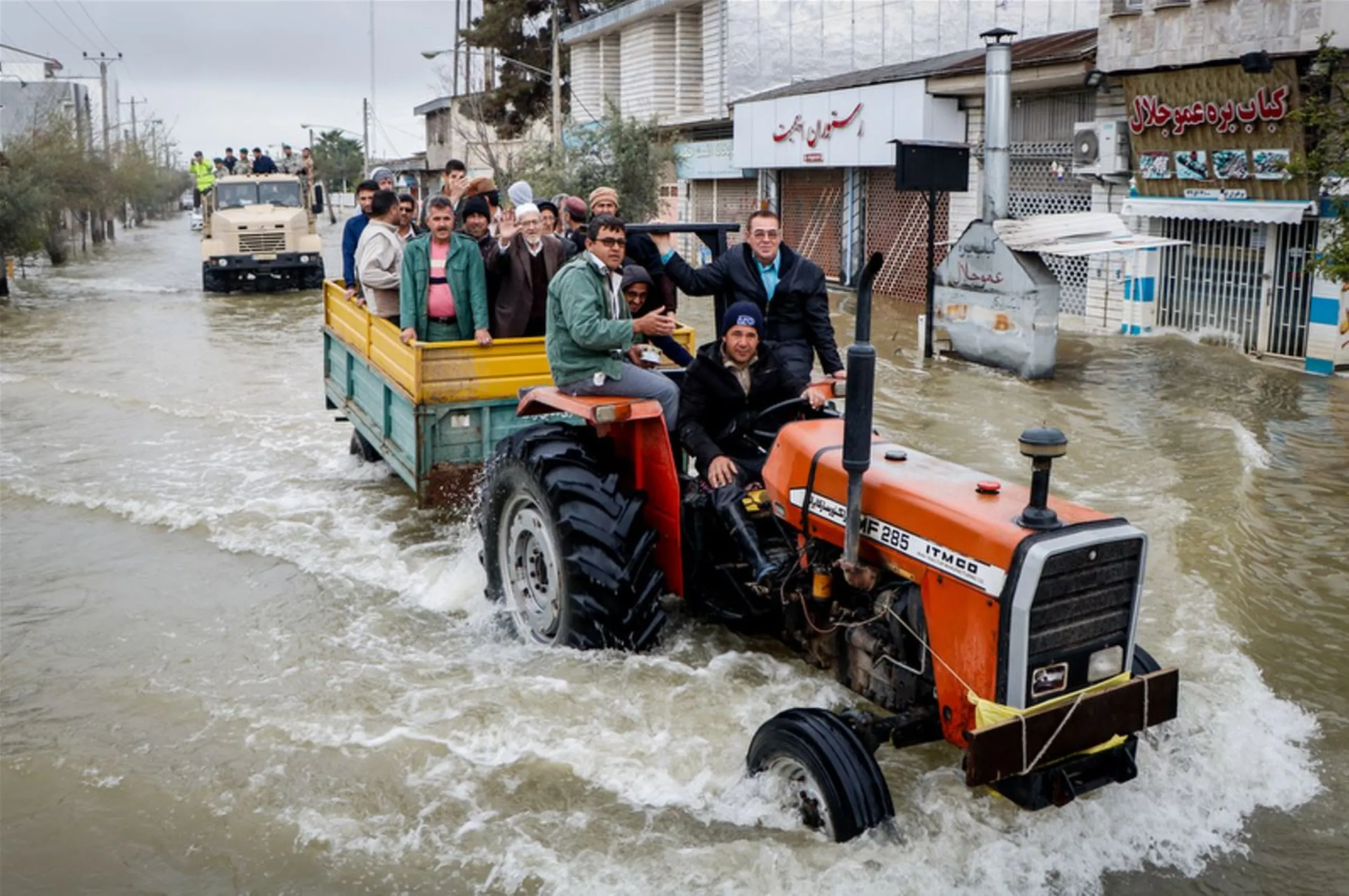 Residents ride a tractor after flash flooding around the northern city of Aq Qala, in Iran’s Golestan province, March 25, 2019. Hossein Esmaeili/Middle East Images via Thomson Reuters Foundation