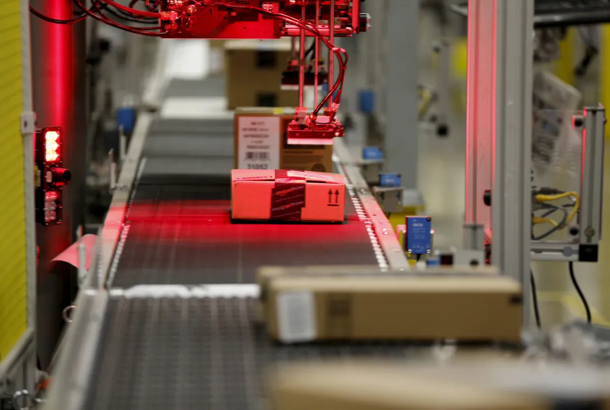 Packaged products are scanned at an Amazon Fulfilment Center