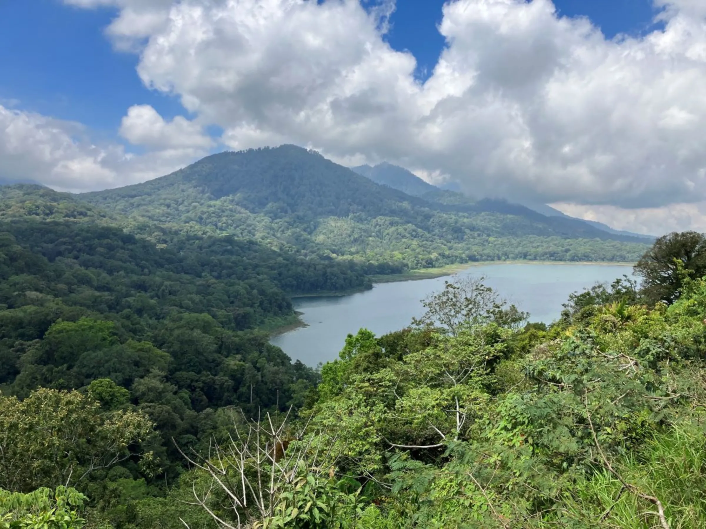 The Alas Mertajati Forest and Tamblingan Lake, which the Adat Dalem Tamblingan Indigenous community are fighting for custodian rights in northern Bali, Indonesia on Sept 19, 2023. Thomson Reuters Foundation/Michael Taylor