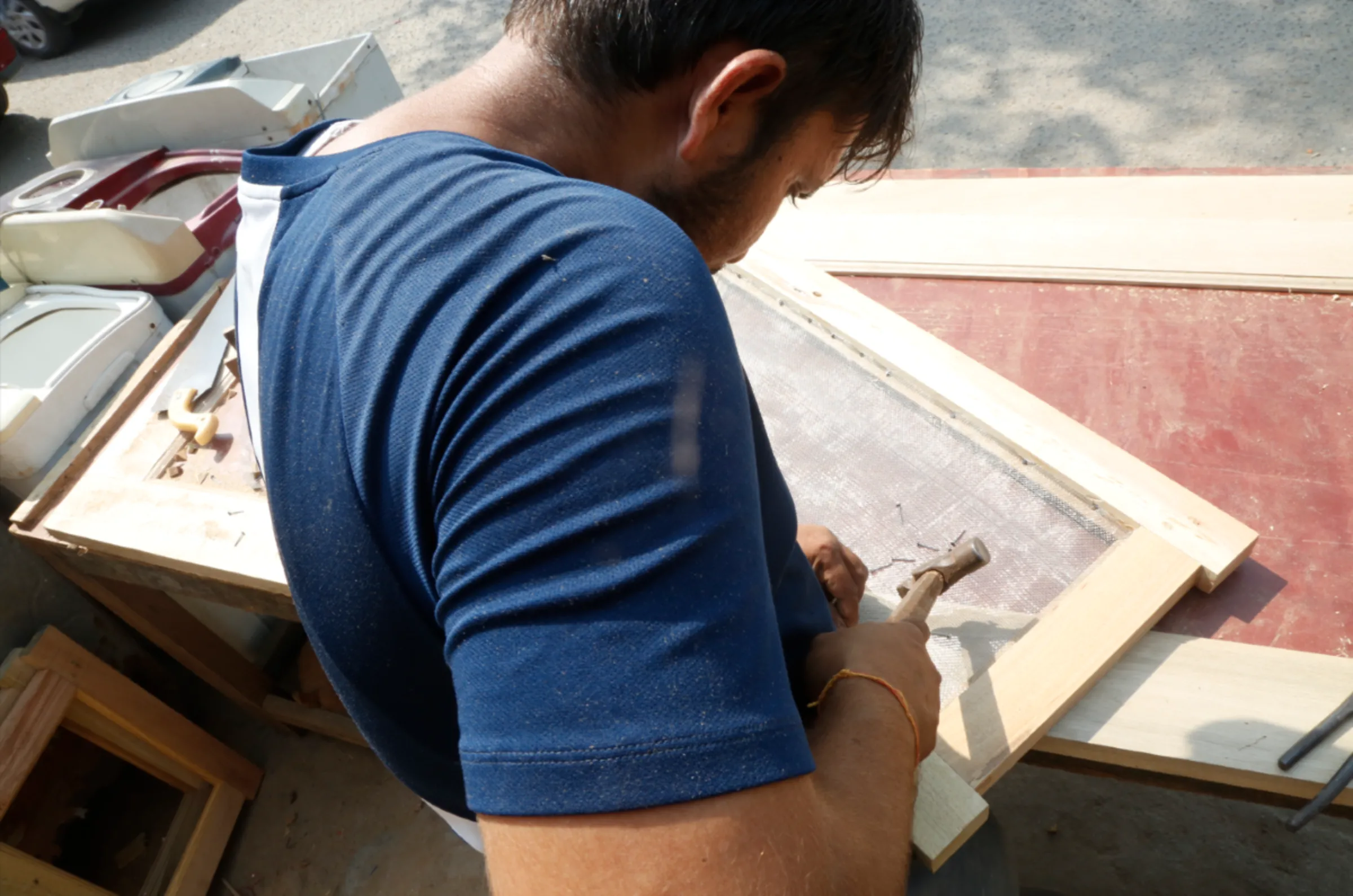 Rakesh Kumar, who signed up for a course with Indian edtech giant Byju's, hammers in a nail at his woodshop in Faridabad, India, October 18, 2022