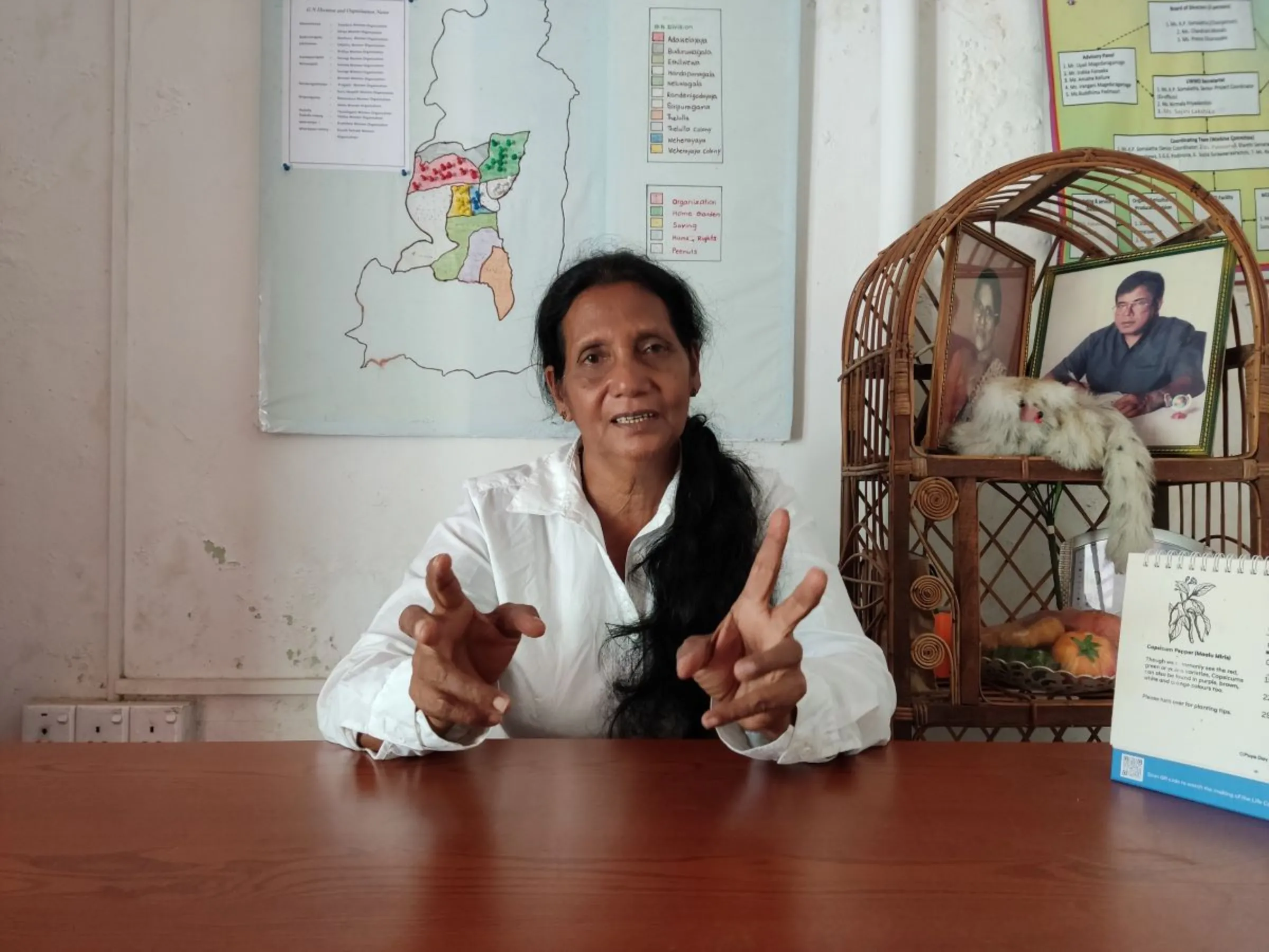 K. P. Somalatha, a leader from the Uva Wellassa Women's Organisation, gestures as she speaks during an interview in Handapanagala, Wellawaya, Sri Lanka. August 2023. Thomson Reuters Foundation/Ranga Udugama
