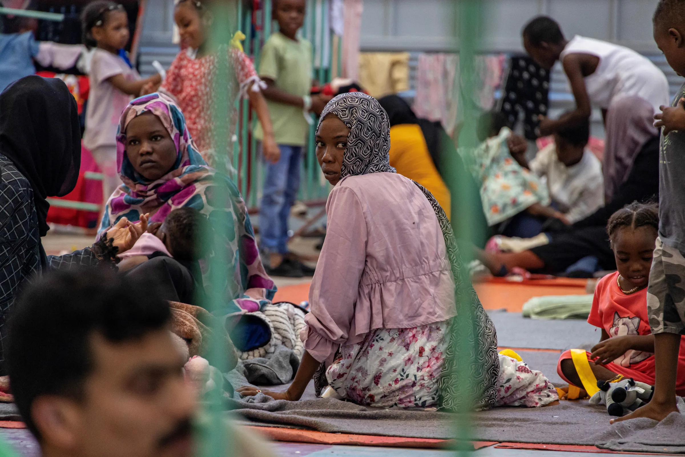Newly-arrived migrants are sheltered in a municipal hall in the town of Agyia, on the island of Crete, Greece, July 13, 2025. REUTERS/Nicolas Economou
