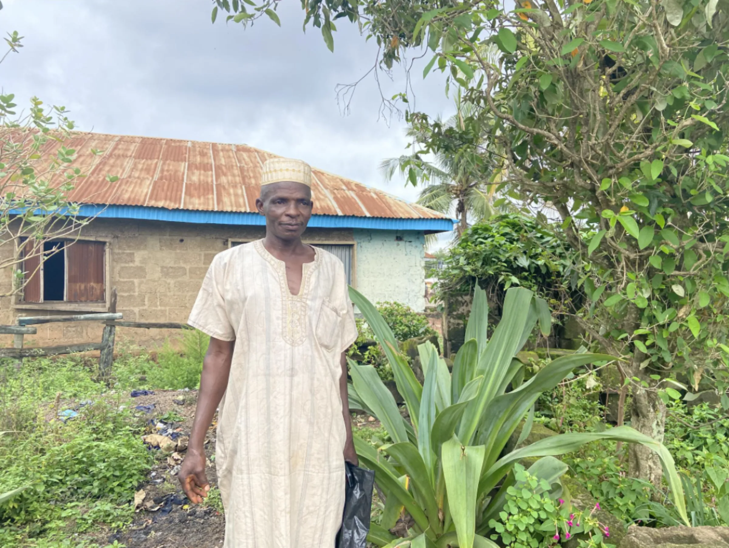 Egunbiyi Yinusa, a traditional healer, stands in a garden at the backyard of his home in Oyo, Nigeria, September 27 2022