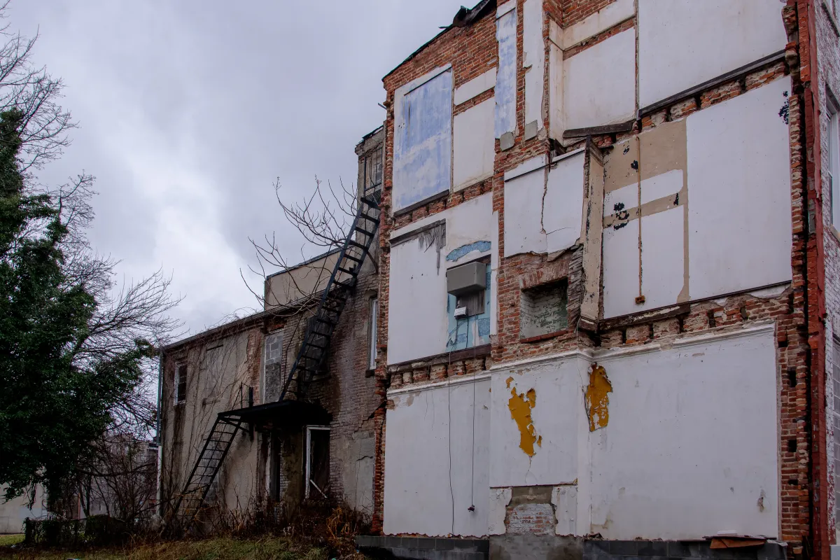 Many rowhomes in West Baltimore have been gutted or torn down in between blocks - leaving exposed walls that were once containment walls between units.