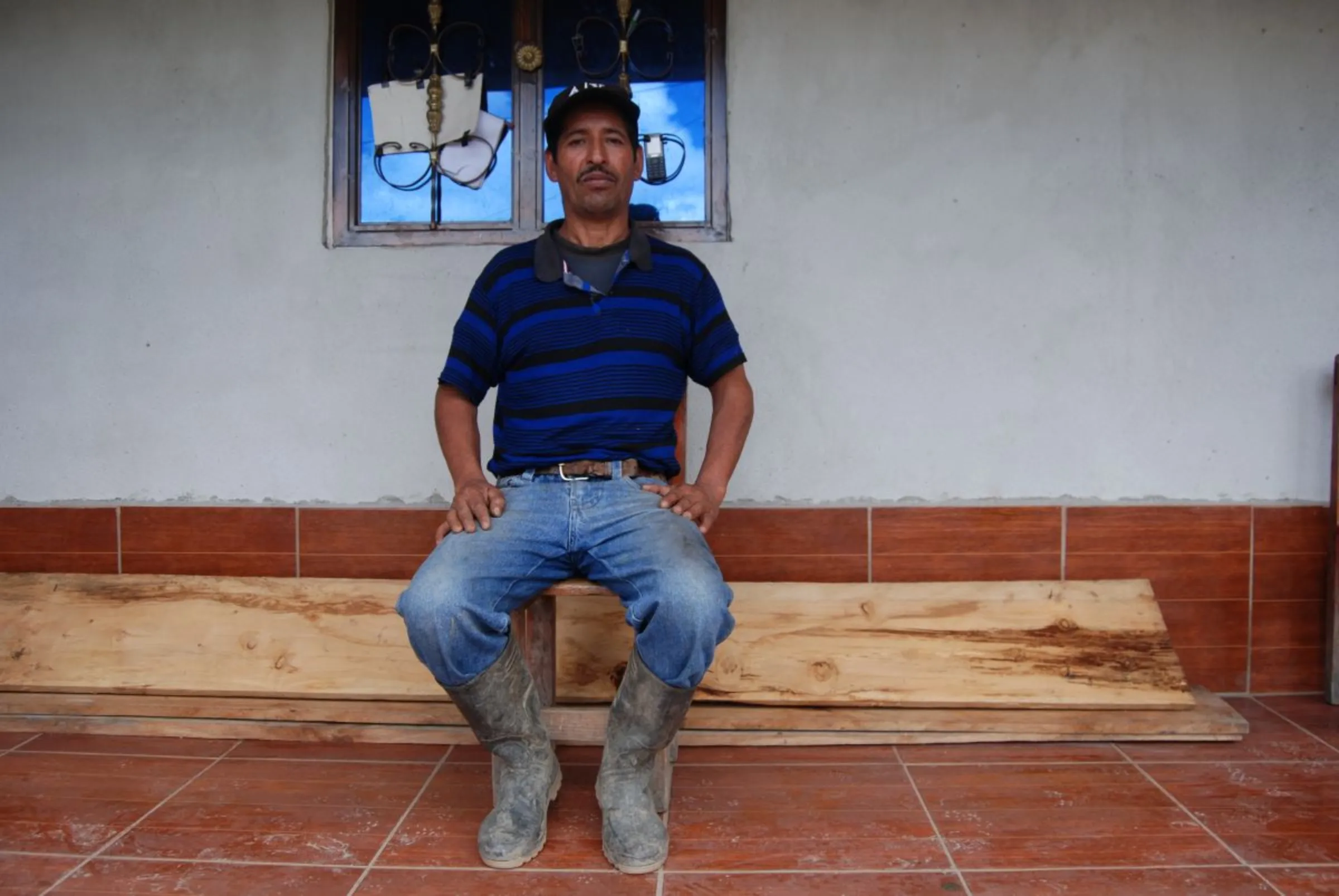 Lucas Cano, who migrated to the United States and then returned to build his house in the hamlet of Canton El Rancho, , in the western highlands of Huehuetenango, Guatemala, September 4, 2023. Thomson Reuters Foundation/Anastasia Moloney