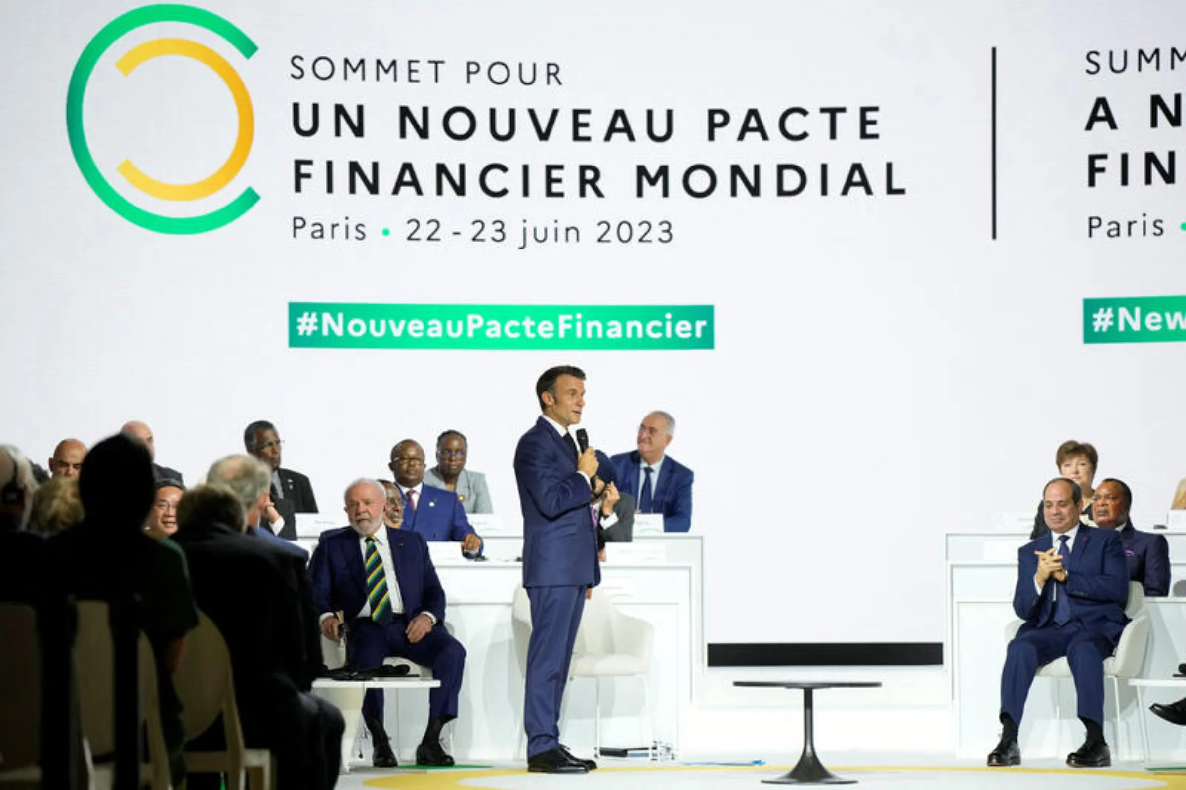 French President Emmanuel Macron, center, speaks while Brazilian President Luiz Inacio Lula Da Silva, left, and Egyptian President Abdel Fattah el-Sisi, right, listen during the closing session of the New Global Financial Pact Summit, Friday, June 23, 2023 in Paris, France. Lewis Joly/Pool via REUTERS