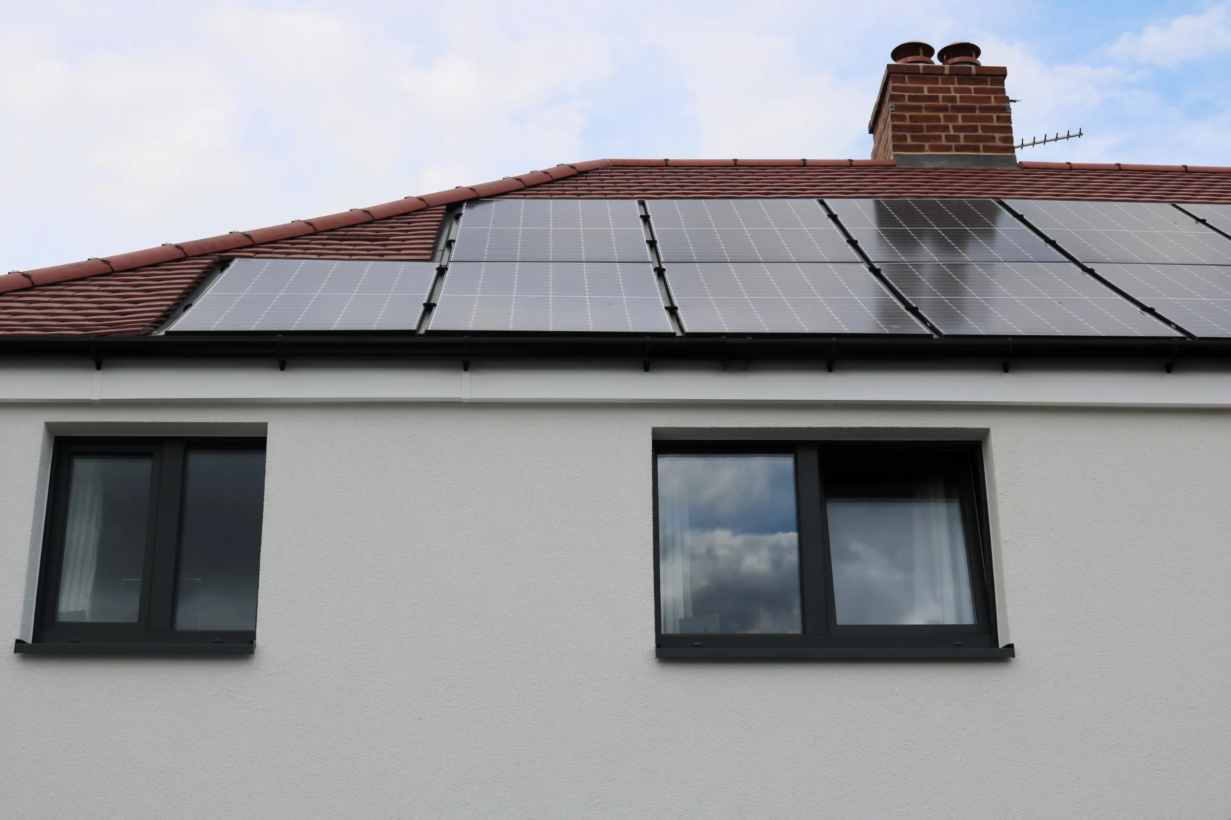Solar panels cover the roof of a residential home