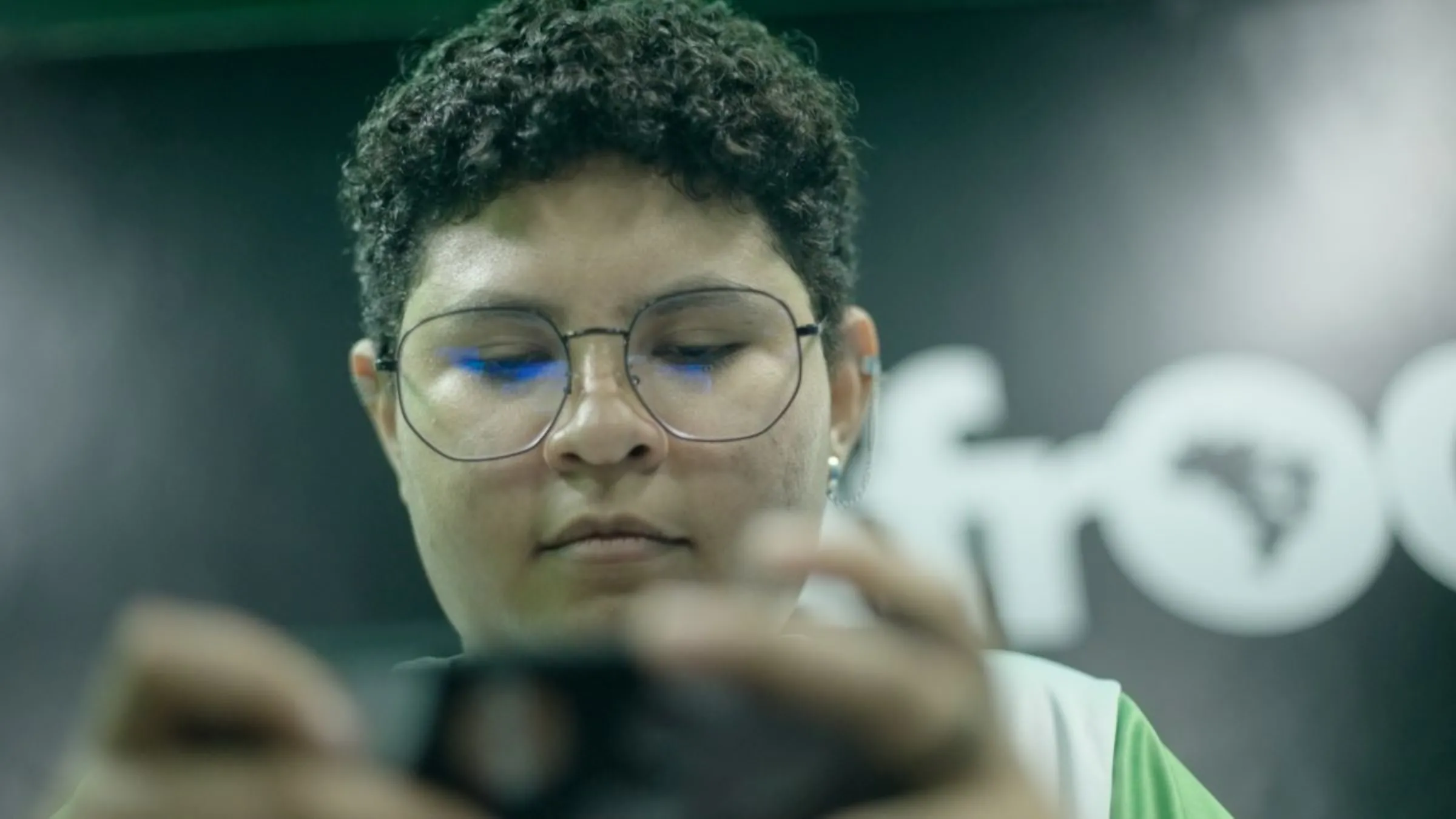 A woman looks at a control for a video game control in this still from the Context video 'Meet the women taking on sexist gaming in Latin America'. Thomson Reuters Foundation/Meghan McDonough