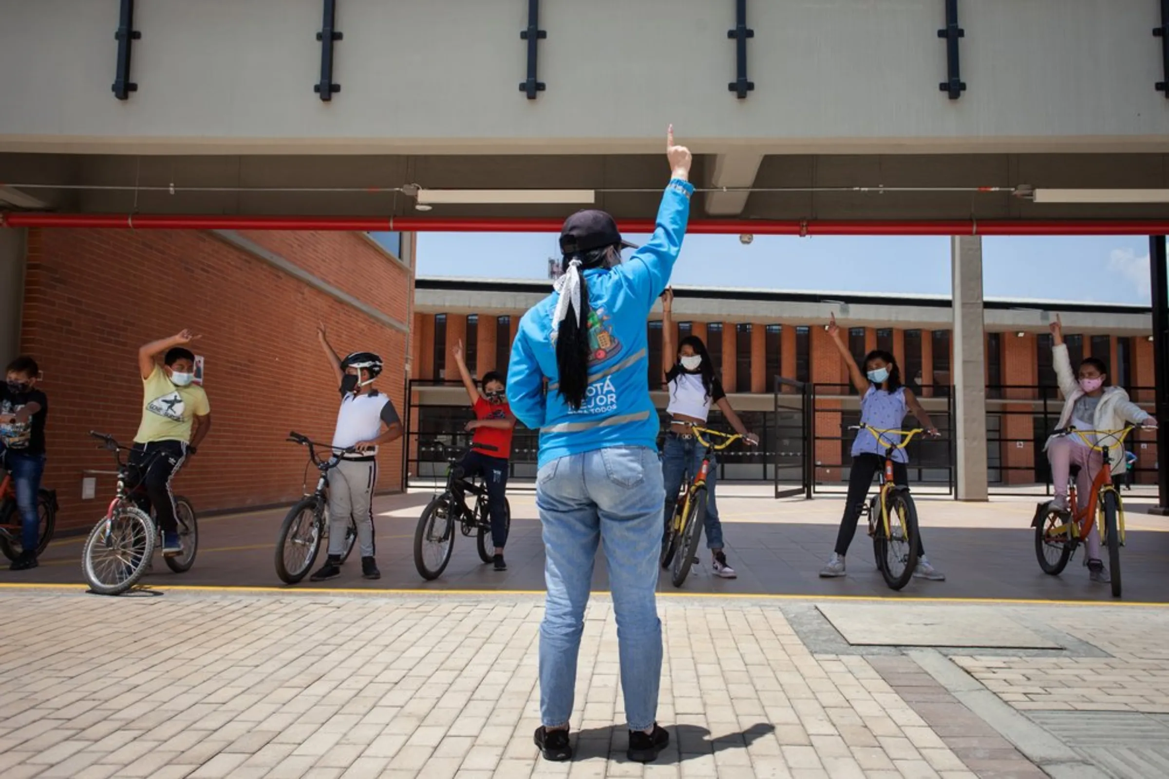 An instructor engages with new cyclists at “The Bike College”, a new public school in the poor neighbourhood of Bosa, in Bogota, Colombia, April 22, 2021
