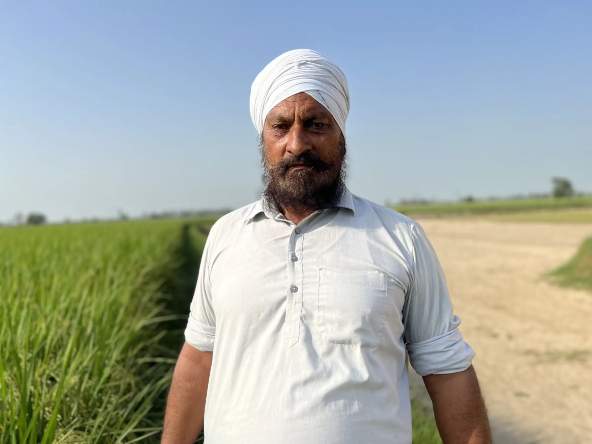 Farmer Gurucharan Singh Bhuttar has changed how he grows wheat to adopt practices such as zero-tilling of the ground, which helps the soil store more carbon, in turn generating carbon credits, in Karnal district, Haryana state, India, September 1, 2023. Thomson Reuters Foundation/Bhasker Tripathi