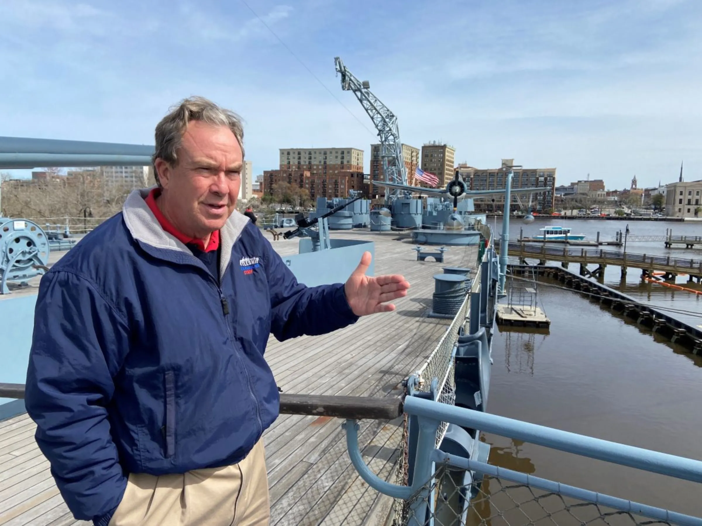 Terry Bragg, executive director of the Battleship North Carolina, is pictured on the ship across the Cape Fear River from downtown Wilmington in North Carolina, USA, February 29, 2024. Thomson Reuters Foundation/David Sherfinski