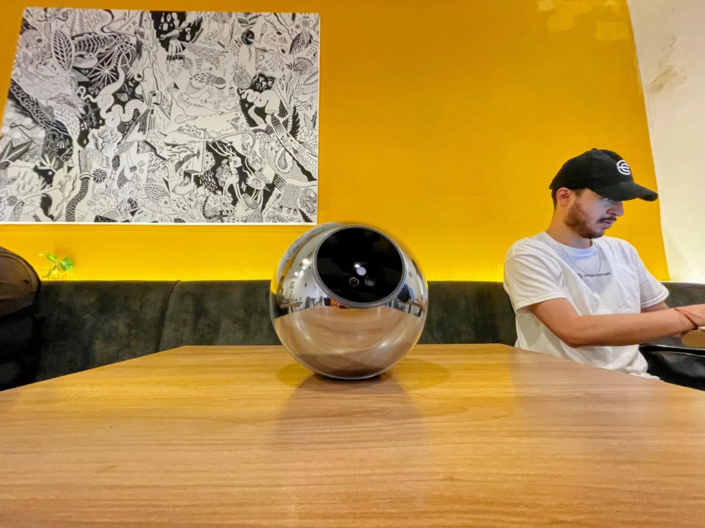 The Orb, a biometric verification device by Worldcoin, lays on a table in a coworking space in Coyoacán, Mexico City. July 24, 2023. Diana Baptista/Thomson Reuters Foundation