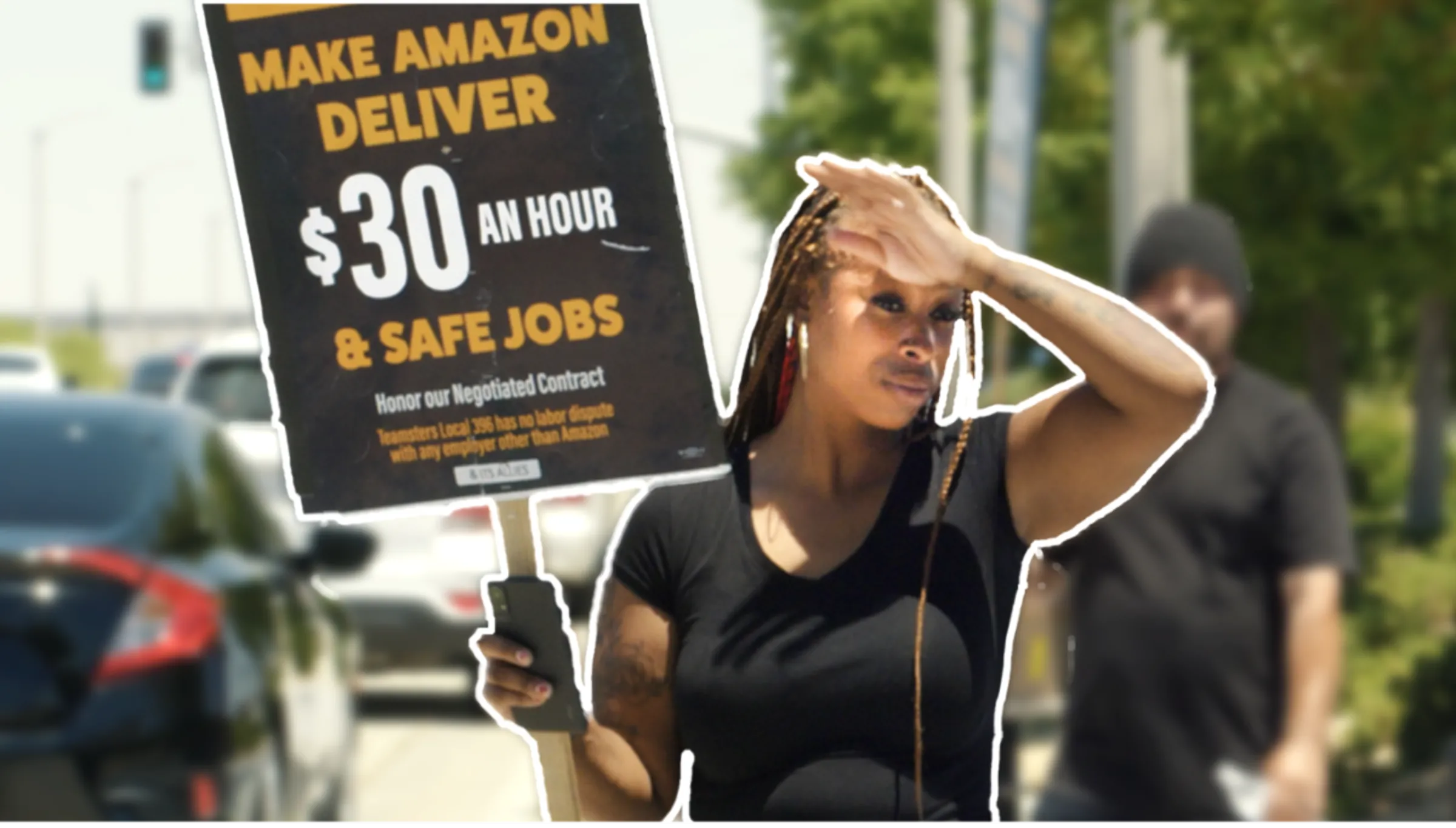 An Amazon delivery worker is striking over extreme heat is seen in this video still