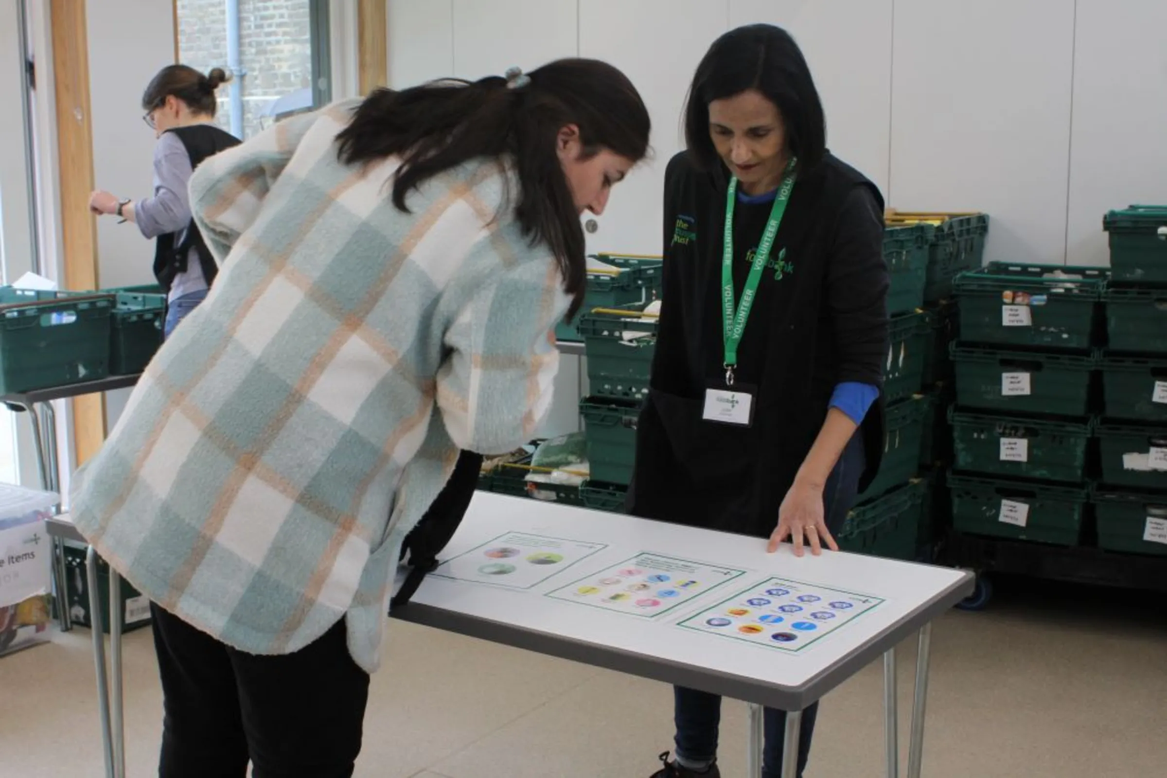 Foodbank recipients at a Hackney Foodbank hub collect donated food and essential items in east London, Britain on April 24, 2023