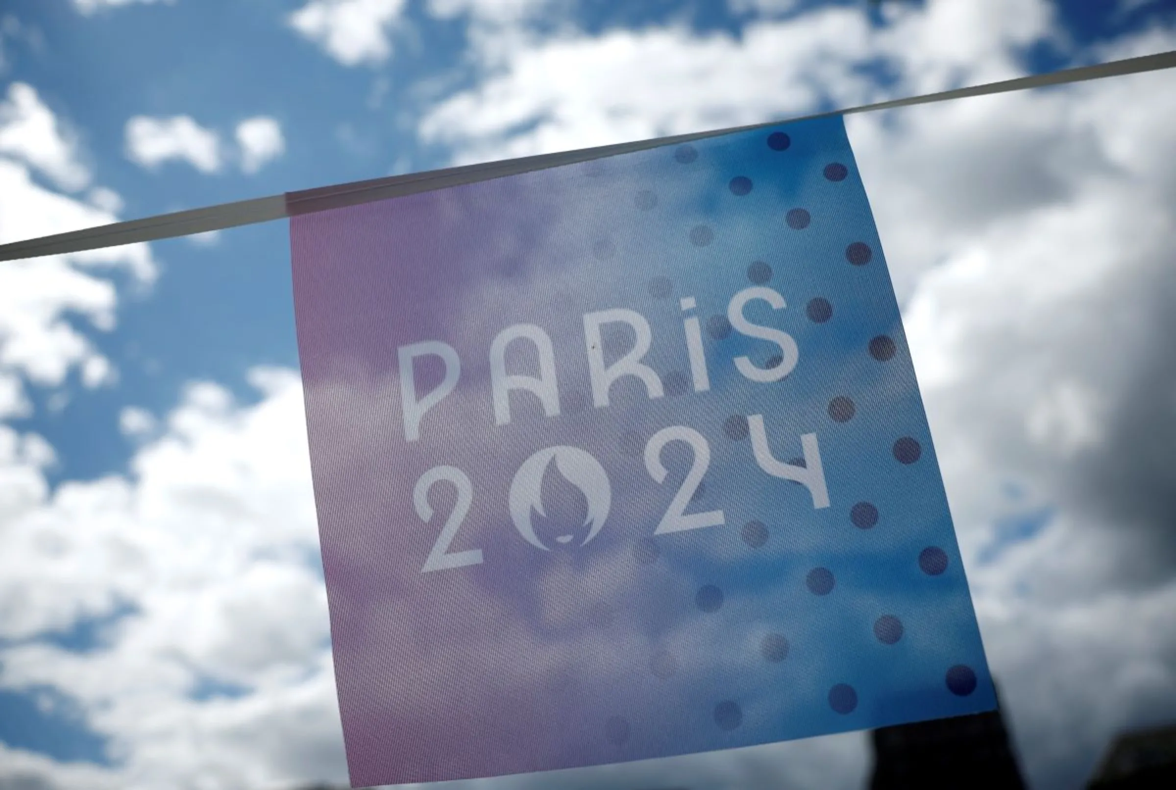 Paris 2024 Olympics - Press visit at the Olympic and Paralympic athletes Village - Saint-Denis, France - July 16, 2024 The Paris 2024 Olympics logo is seen on a banner in the Olympic village REUTERS/Benoit Tessier