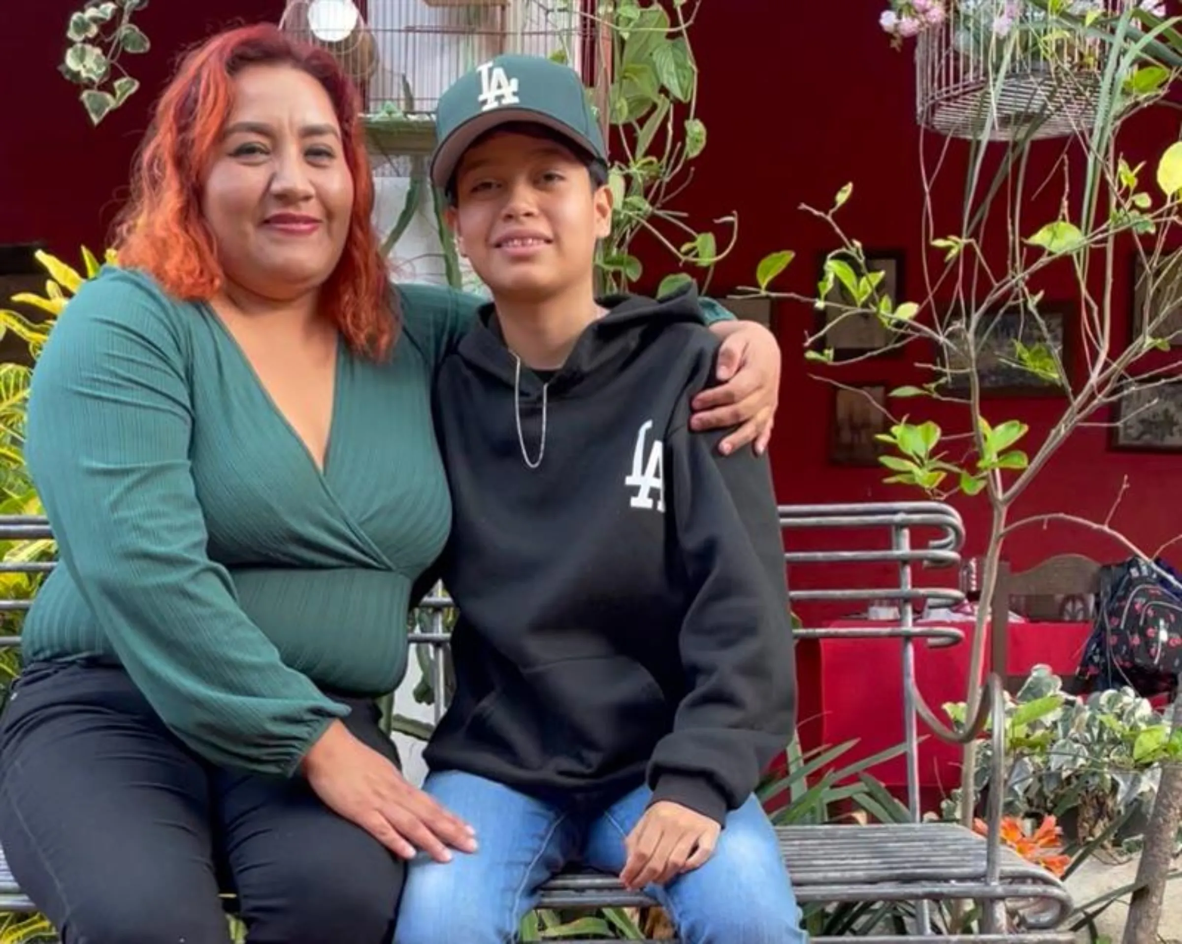 Brenda Quiroz and her son, Jessie Quiroz, pose for a photo in Sola de Vega, Oaxaca, Mexico, June 24, 2025. Thomson Reuters Foundation/Diana Baptista