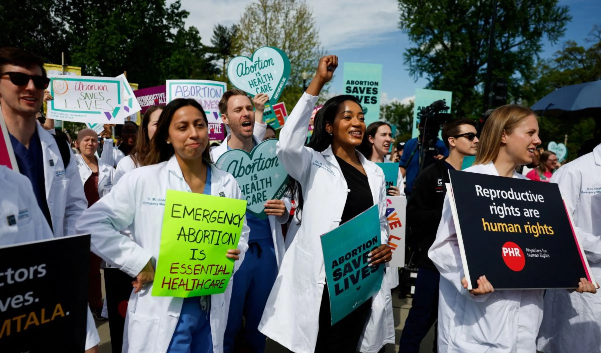 People gather during a protest in support of reproductive rights and emergency abortion care, as Supreme Court justices hear arguments over Idaho's near-total abortion ban in medical-emergency situations, in Washington, U.S., April 24, 2024. REUTERS/Evelyn Hockstein