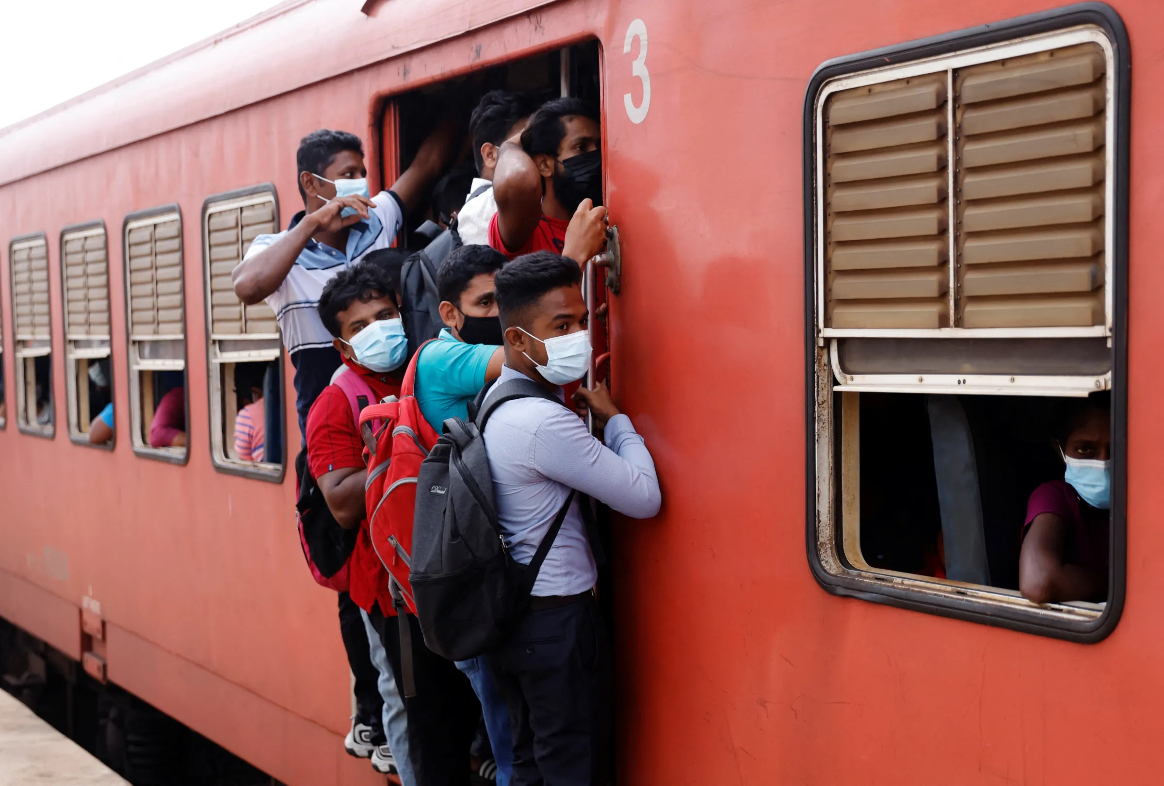 Passengers ride on an overcrowded train as public transportation gets limited fuel amid Sri Lanka's economic crisis, in Colombo, Sri Lanka, July 29, 2022