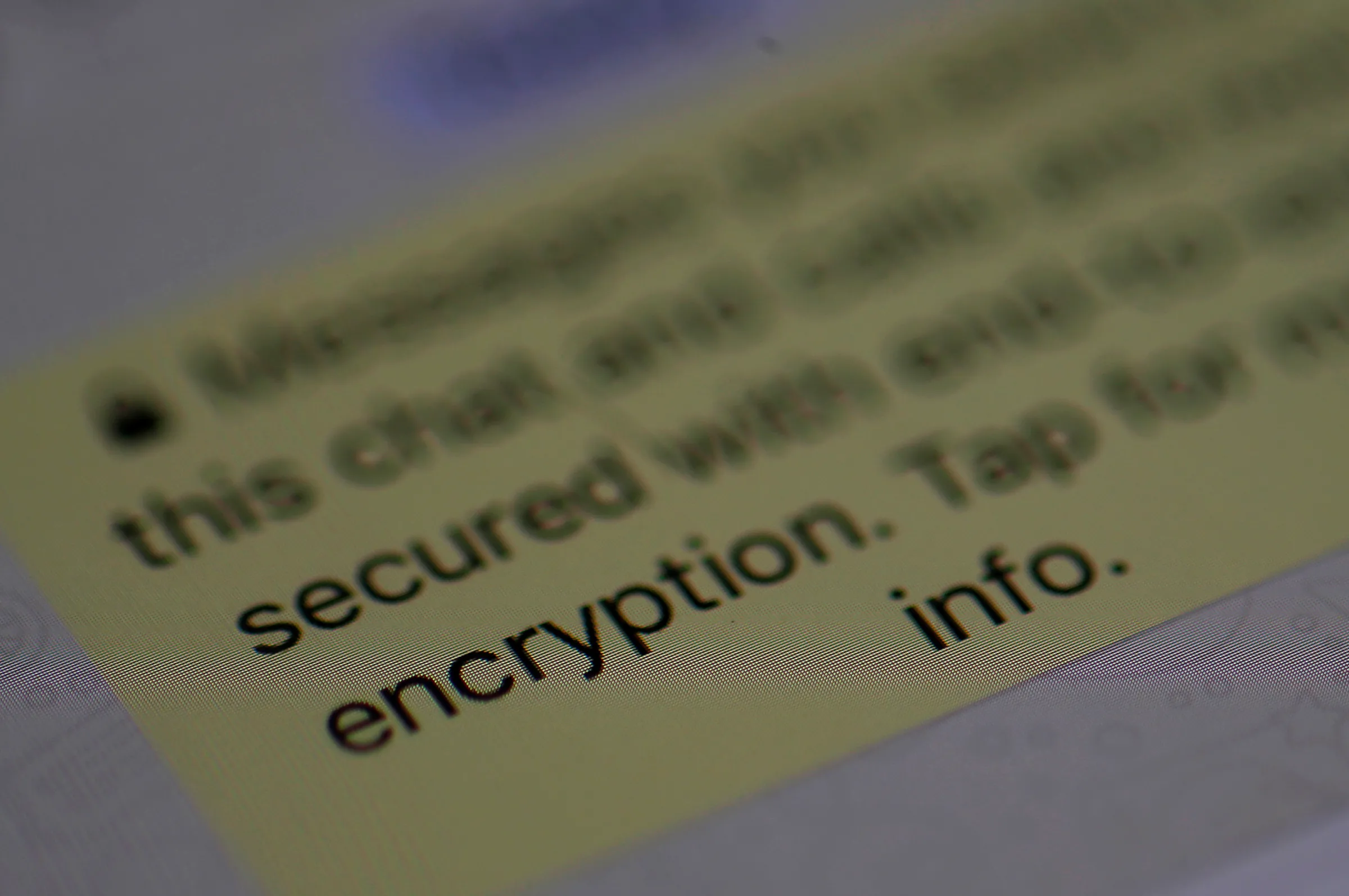 An encryption message is seen on the WhatsApp application on an iPhone in Manchester, Britain March 27, 2017
