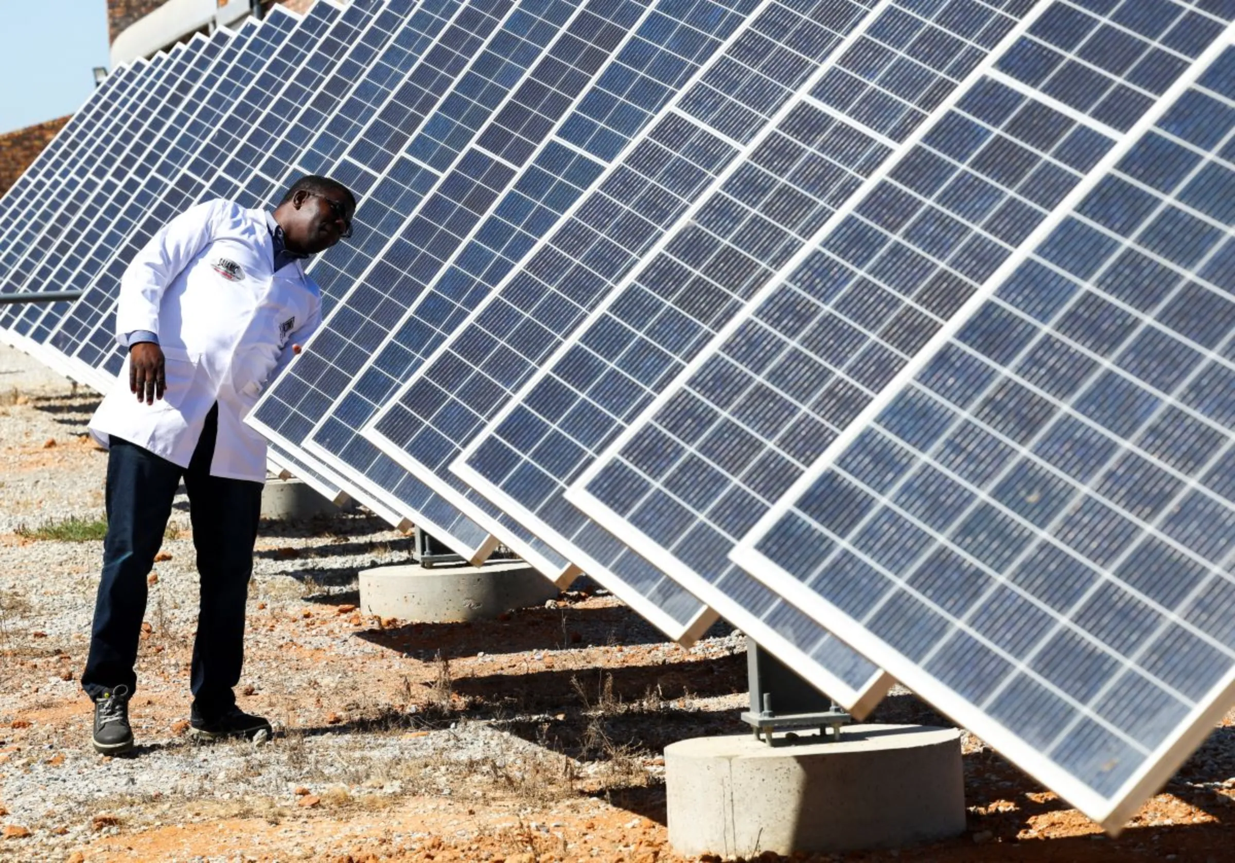 Dr Stanford Chidziva, acting director of Green Hydrogen, looks at the solar panels in the University of the Western Cape, South Africa, November 15, 2022. REUTERS/Esa Alexander
