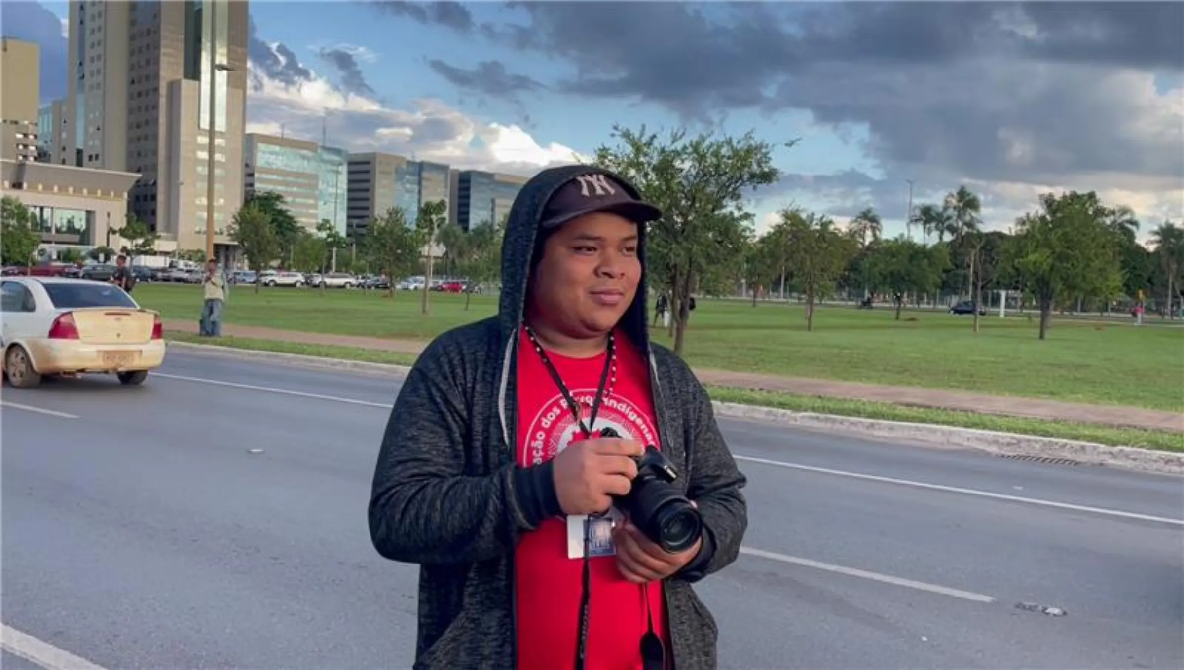 Guarani Mbya photographer Richard Wera Mirim covers the march from the Indigenous movement at the Free Land Camp in Brasilia, Brazil, April 10, 2025. Thomson Reuters Foundation/André Cabette Fábio