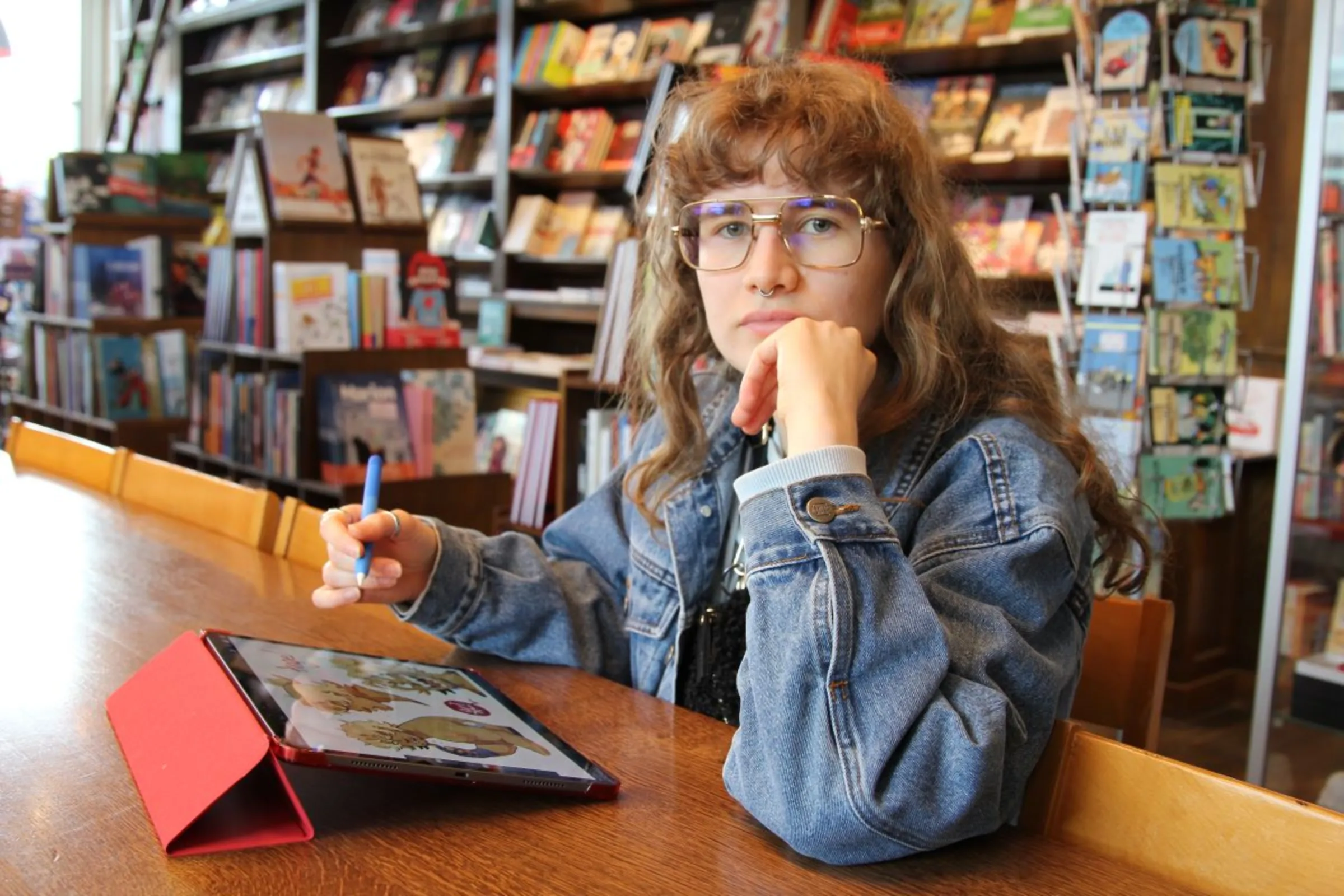 Sarah Vanderhaegen, now draws comics in her spare time after her artistic aspirations were crushed by AI-use in the creative industry. Brussels, Belgium, May 2024. Thomson Reuters Foundation/Joanna Gill