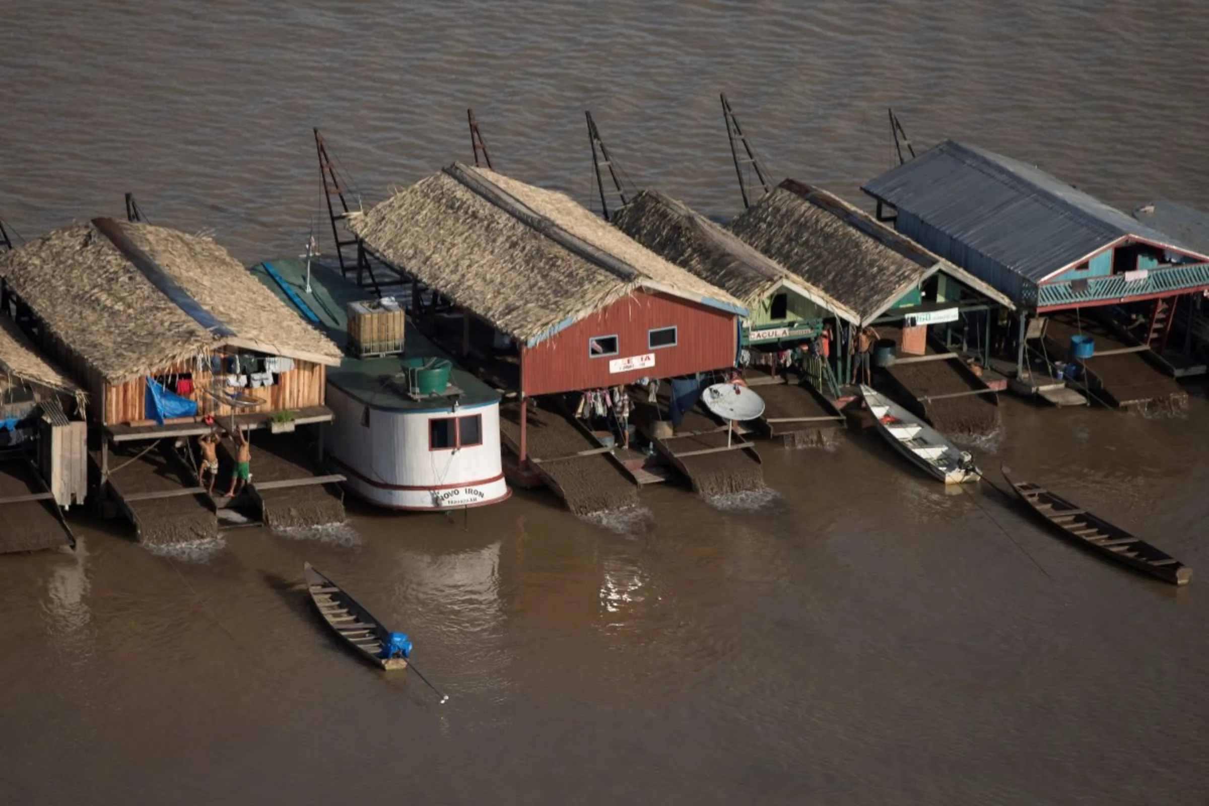 Hundreds of dredging rafts operated by illegal miners sit on the Madeira, Amazonas state, Brazil Nov. 23, 2021. REUTERS/Bruno Kelly