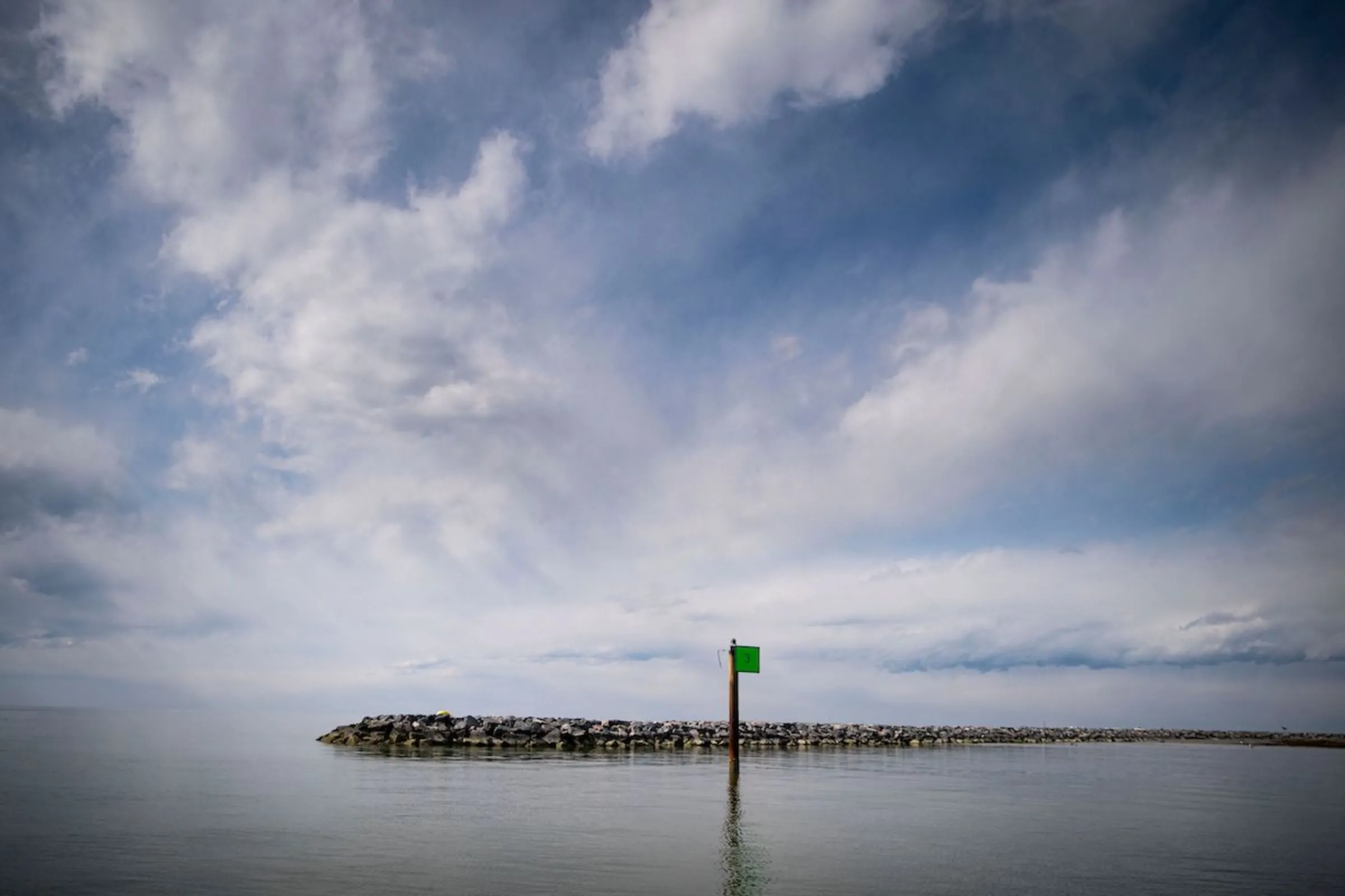 Residents hope that another seawall or jetty can help slow Tangier’s gradual loss of land mass. On the west edge of Tangier Island, Virginia, U.S., March 28, 2022. Thomson Reuters Foundation./Al Drago