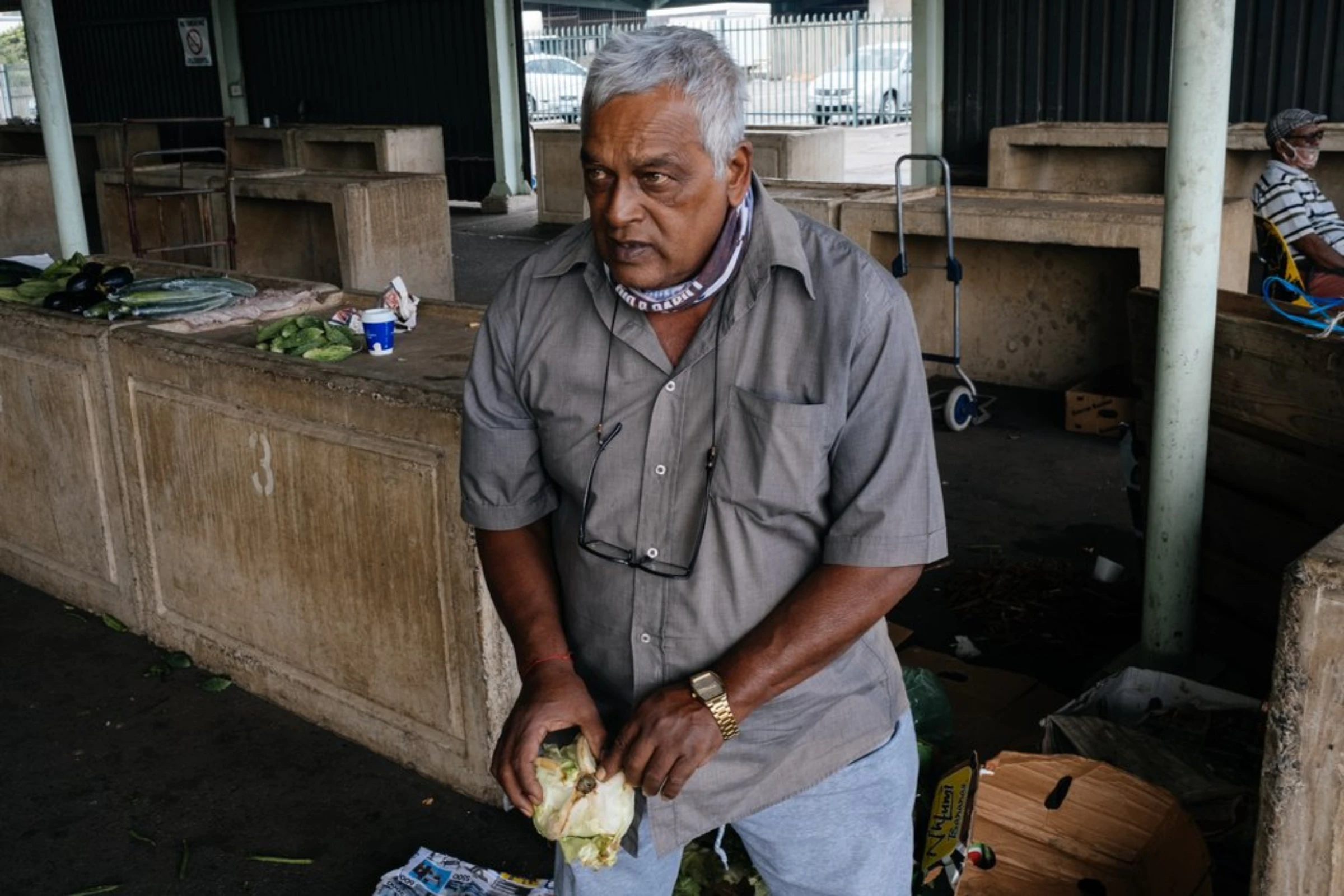Pietermarizburg-based farmer Smith Ramdeva, points out “club root”, a mould attacking one of the cabbages he has delivered to the fresh produce market in Clairwood, Durban, South Africa, March 30, 2021