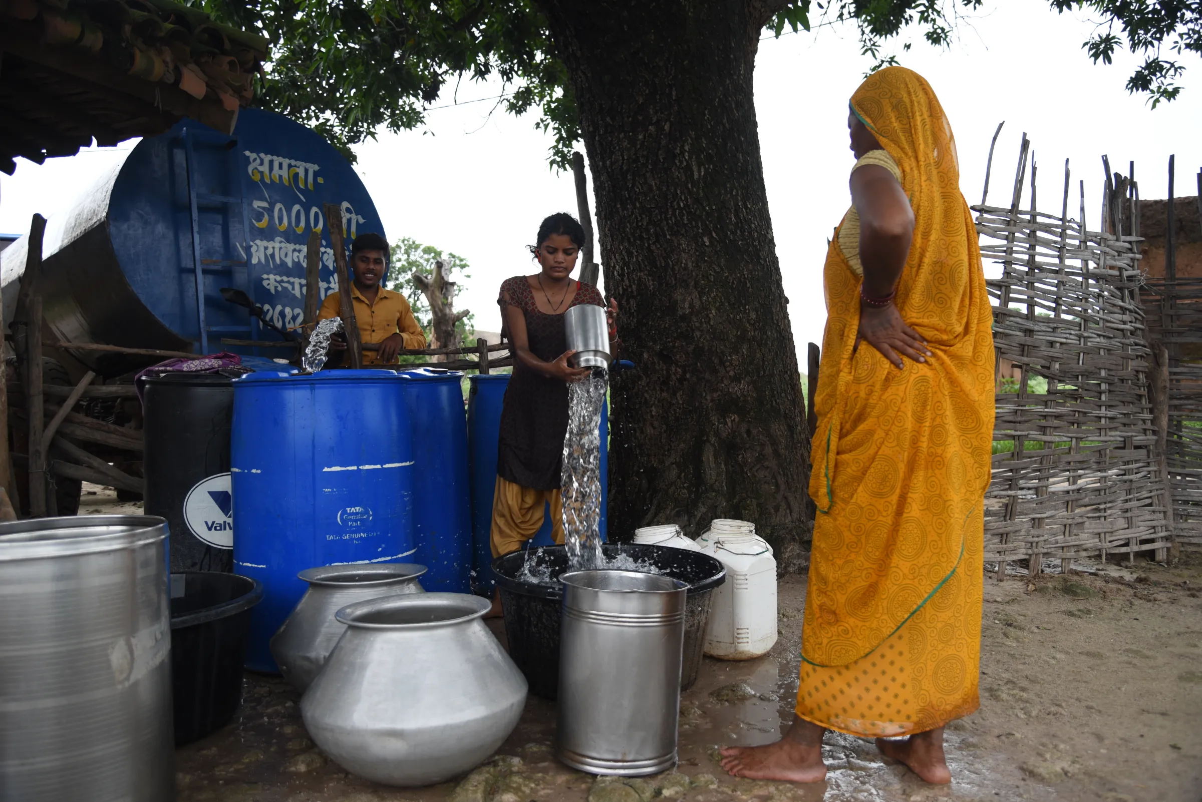 Resident of Muher village, surrounded by coal mines, storing water from a tanker, the only source of fresh water for the village. Singrauli, India, on August 28, 2024. Thomson Reuters Foundation/Tanmoy Bhaduri