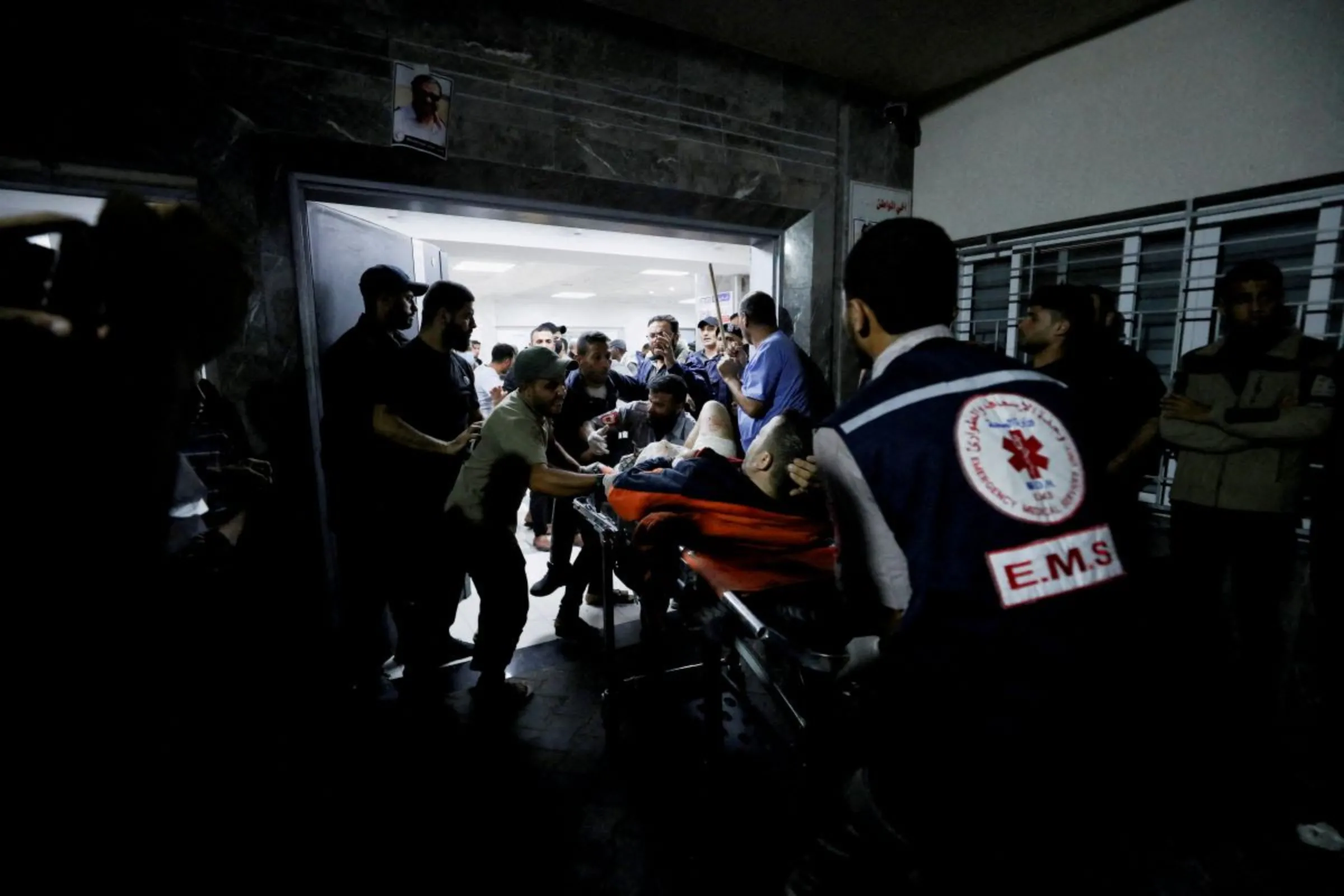An injured person is assisted at Shifa Hospital after hundreds of Palestinians were killed in a blast at Al-Ahli hospital in Gaza that Israeli and Palestinian officials blamed on each other in Gaza City, Gaza Strip, October 17, 2023
