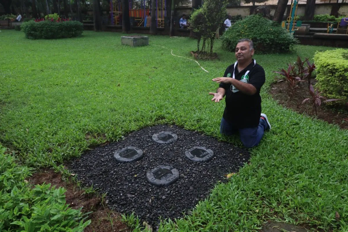 Subhajit Mukherjee, founder of Mission Green Mumbai, explains the functioning of rainwater harvesting pits built at a garden in Mumbai, India, September 17, 2021