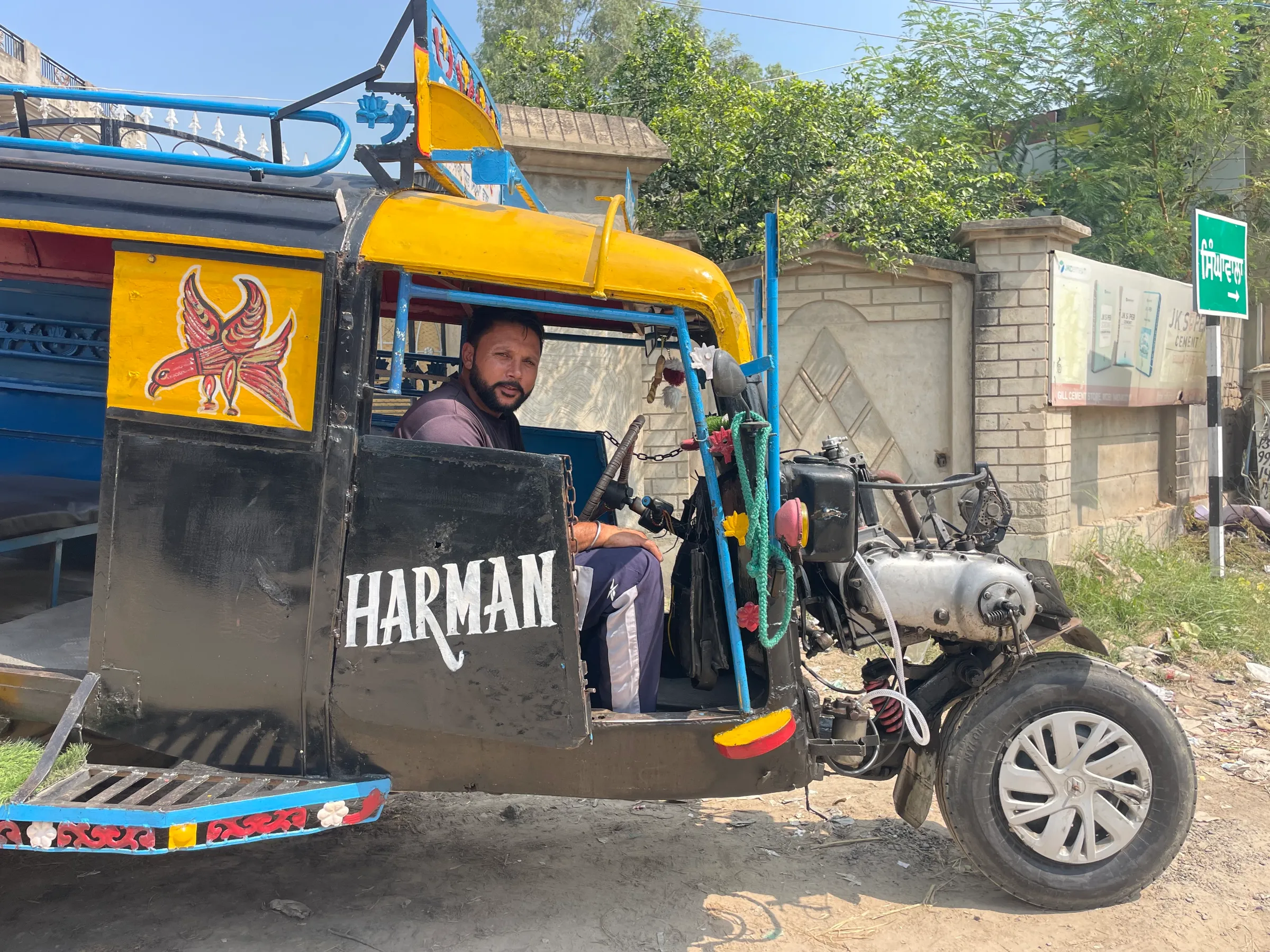 Amanpreet Singh, an autorickshaw driver, who plans to join his brother in Italy on a seasonal work permit, poses for a photo in Chand Nawan village of Punjab, India, September 24, 2024. Thomson Reuters Foundation/Sandeep Singh