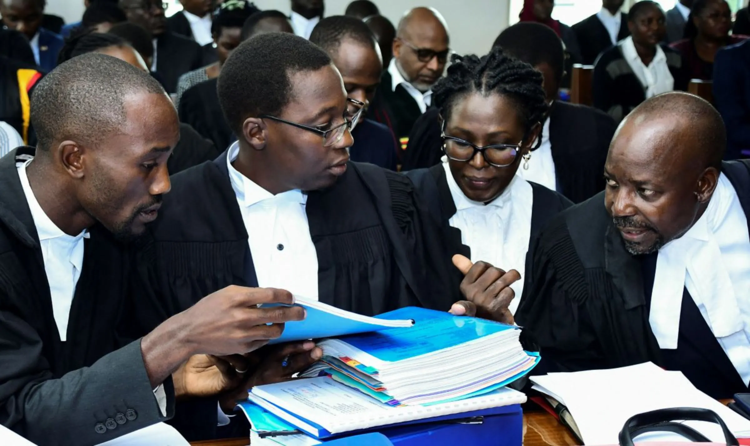 Human Rights lawyers led by West Budama North East Constituency Member of Parliament Fox Odoi-Oywelowo (R) attend the hearing of petitions and applications challenging the Anti-gay law at the constitutional court in Kampala, Uganda November 28, 2023. REUTERS/Abubaker Lubowa