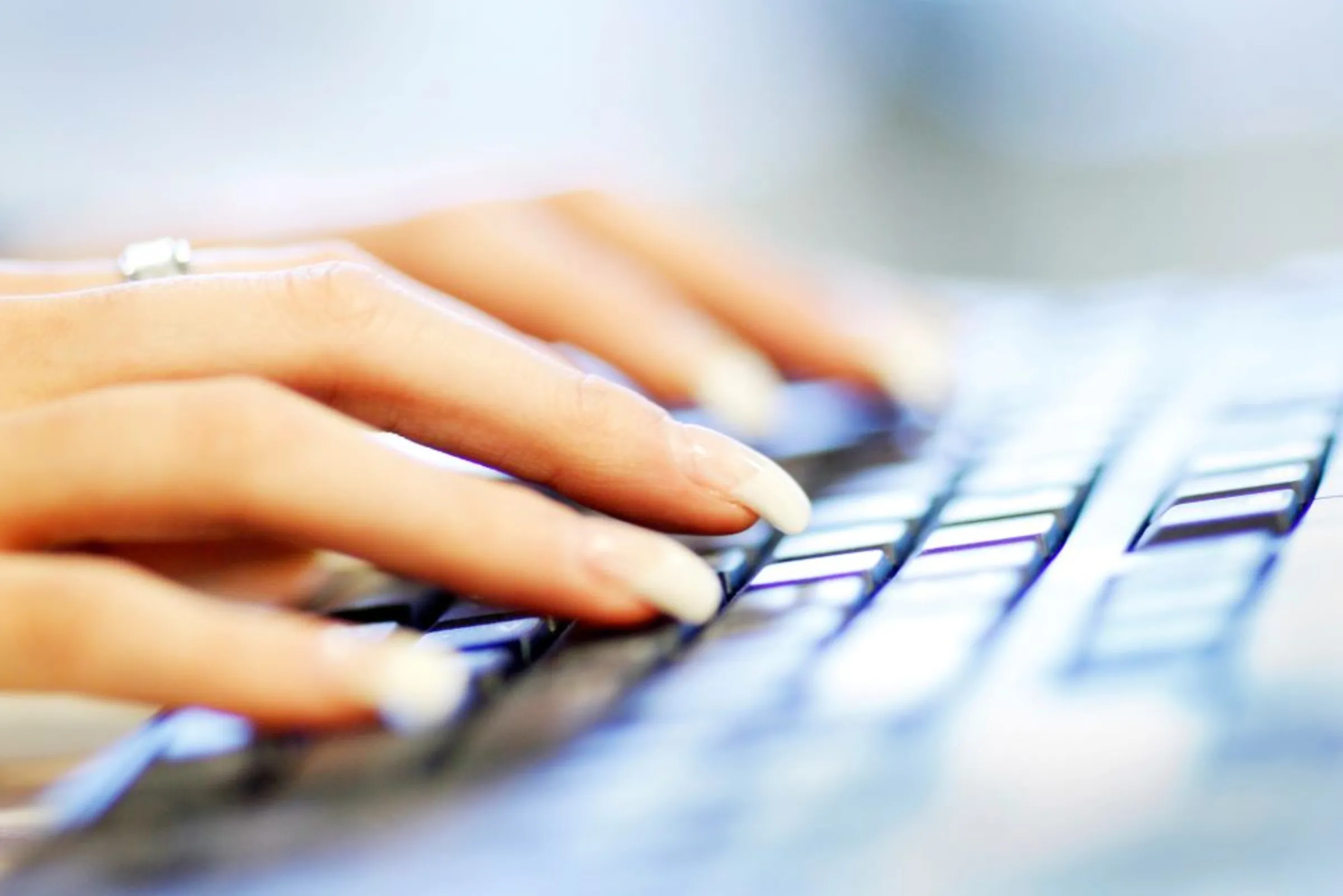 A woman uses a computer keyboard in this photo illustration taken in Sydney June 23, 2011
